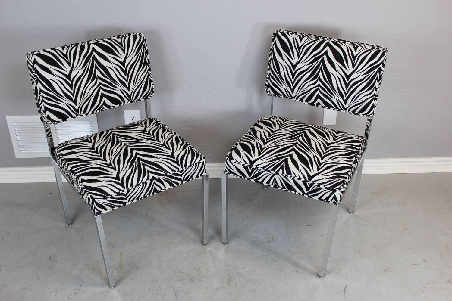Stainless steel and zebra fabric side chairs in the style of Milo Baughman. Restored.