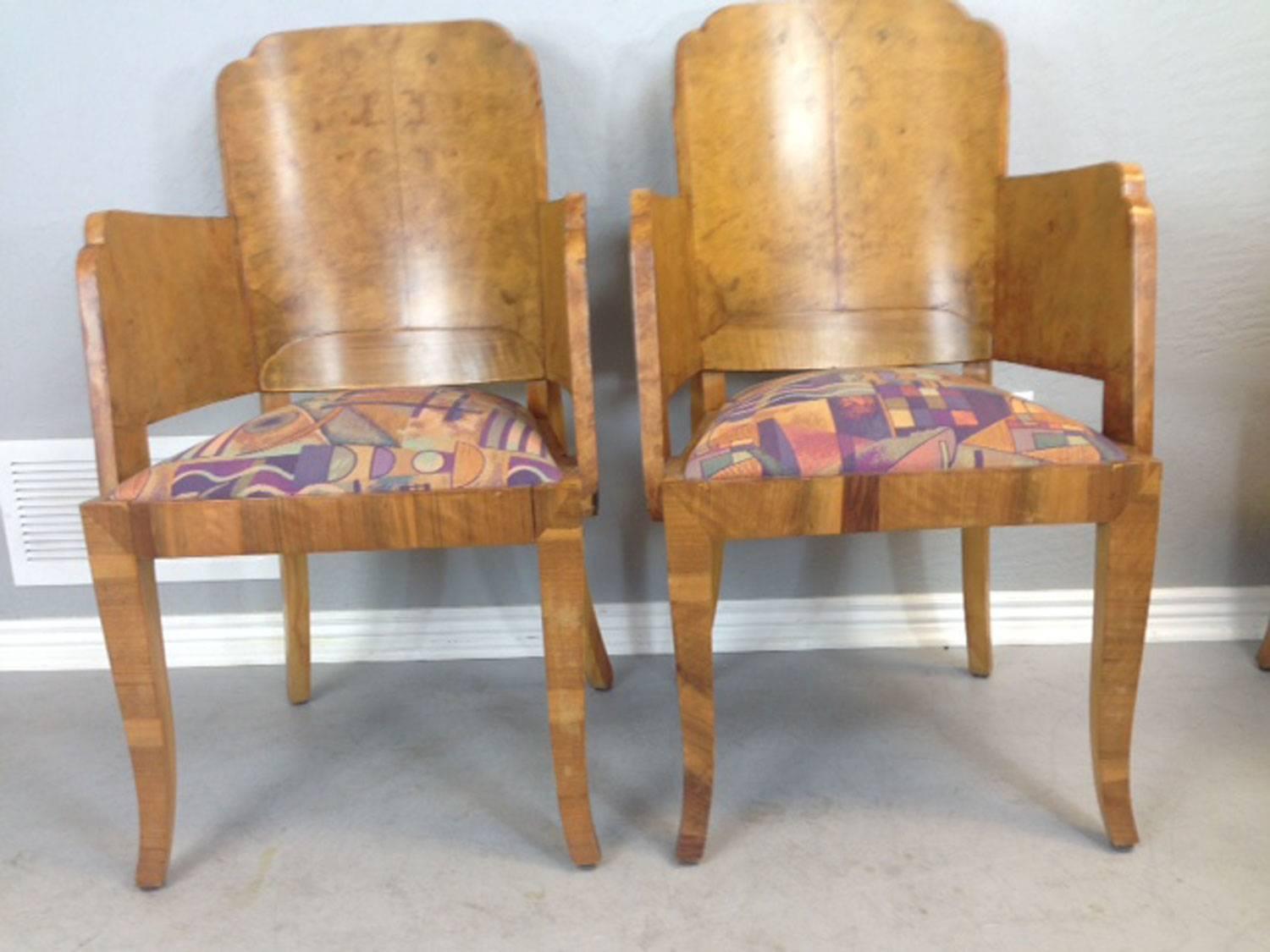 Rare Marcel Guillemard French Art Deco dining room table and eight chairs. Book-match amboyna wood from the padauk tree now famous for its use on Rolls Royce and Mercedes automobile dashboards. The burl wood nature of the grain of this wood lends