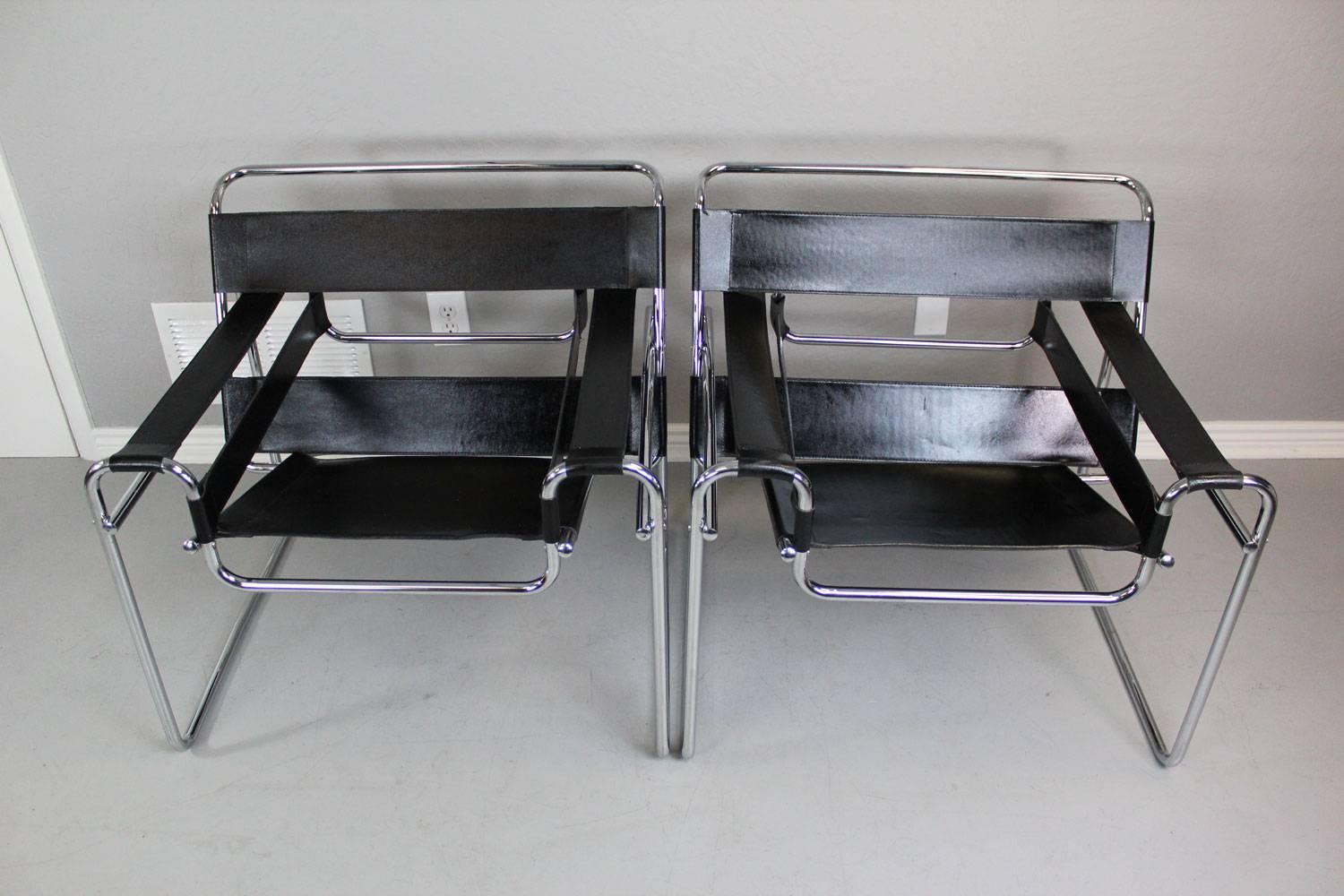 Vintage pair of B3 Wassily lounge chairs, designed by Marcel Breuer, with stitched black leather and a chromed steel tube frame, all in excellent condition.

Marcel Breuer was an apprentice at the Bauhaus in 1925 when he conceived the first