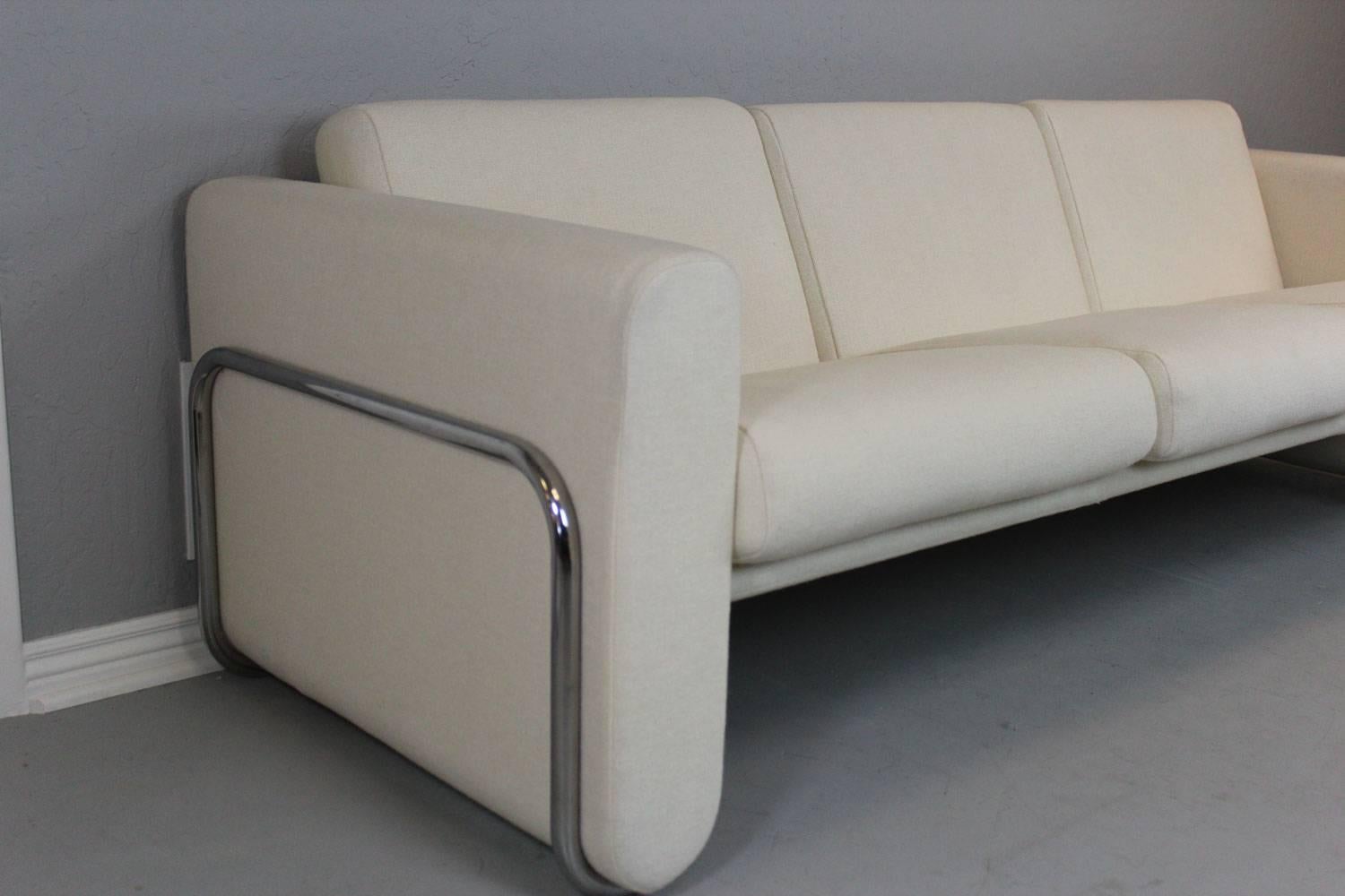 LeCorbusier style white sofa with stainless steel wrap around frame. Custom-made for an architect in the mid-1960s by Herman Miller. All original long wearing wool fabric. Superb condition. A show stopper.

Dimensions: Sofa - 86