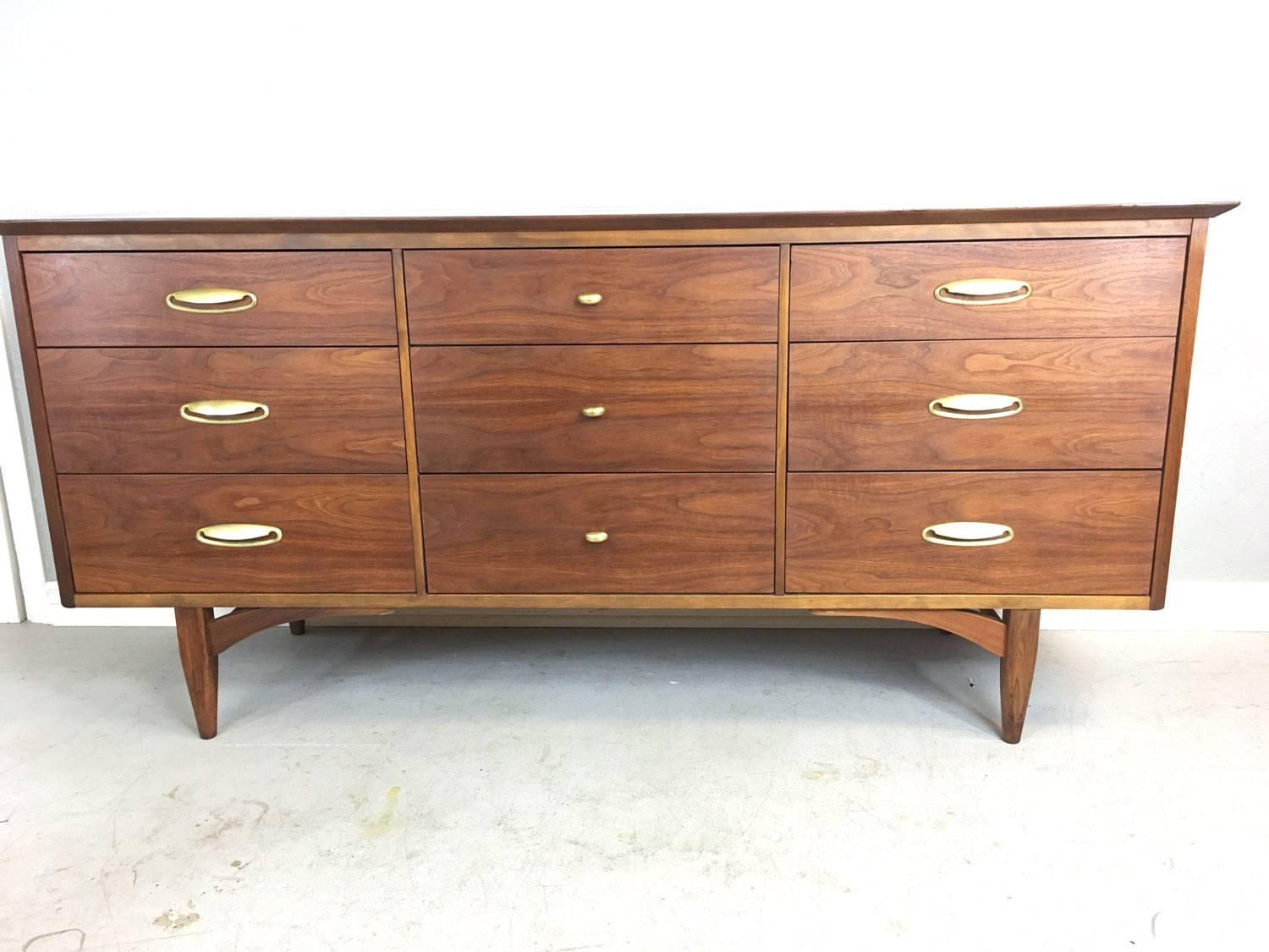 Sleek nine-drawer "Vega" dresser by Morris in walnut. Vega was the high end line by Morris and note that the walnut used by Morris is so rich that it often it is mistaken as teak. The craftsmanship on this dresser is exquisite. See the