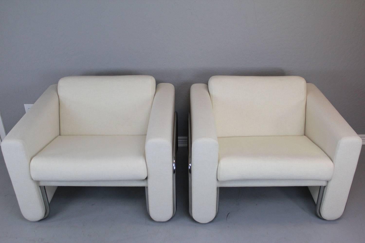 LeCorbusier style white club chair pair with stainless steel wraparound frames. Custom-made for an architect in the mid-1960s by Herman Miller. All original long wearing wool fabric. Superb condition. A show stopper.