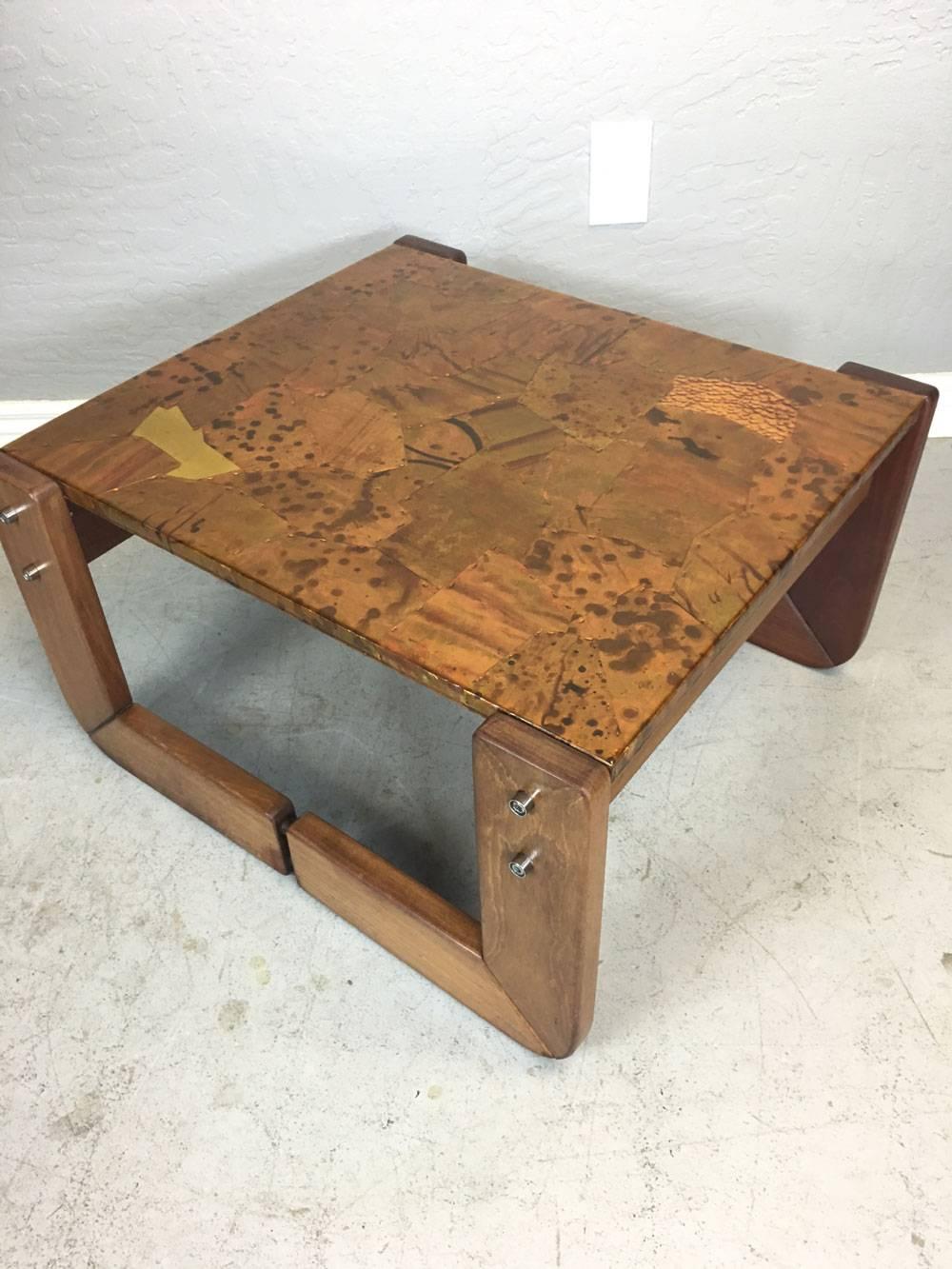 Percival Lafer hand-hammered copper and bronze side table with a rosewood frame. Original stain. They are cleverly designed so that steel braces can be unlocked for easier transport.