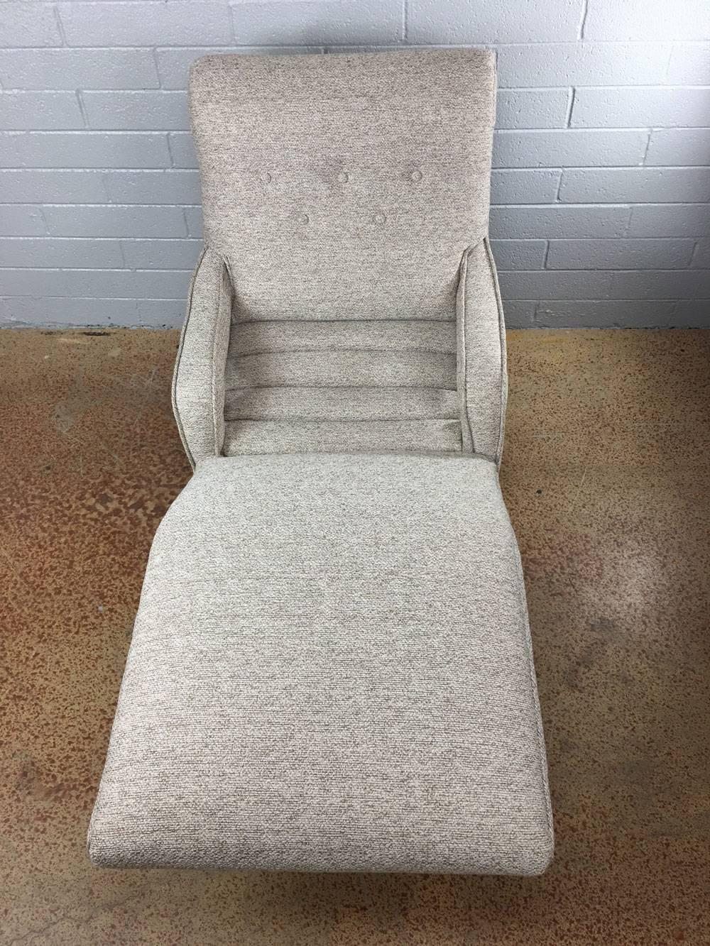 Newly reupholstered and refurbished contour lounge chair, with original nailhead tacks. Manual lever almost effortlessly moves the lounge chair on its ball bearings to the desired position. Note the original metal plate on the backrest. Other