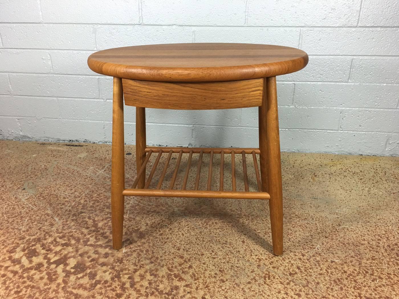 Solid Danish teak side table with drawer. Lower magazine shelf. No maker.