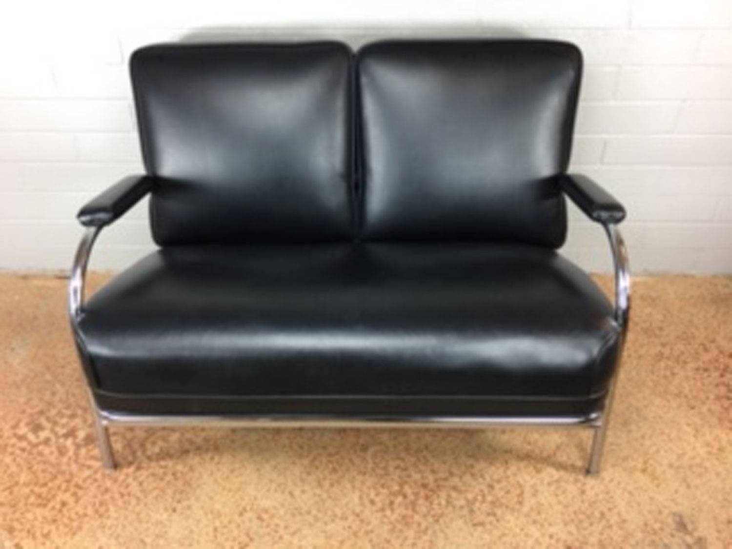 Art Deco chromed loveseat by KEM Weber. Chrome is in very good condition. Heavy black Naugahyde cover material is in excellent condition. No rips, tears, wear, or holes. This KEM Weber unit is quite heavy and built to last. We have one of these