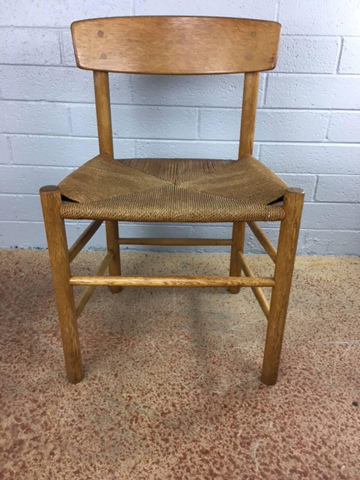 Borge Mogensen set of four oak framed model J39 dining chairs. Paper cord seat webbing is in very good condition. All intact. Price is for all four chairs.