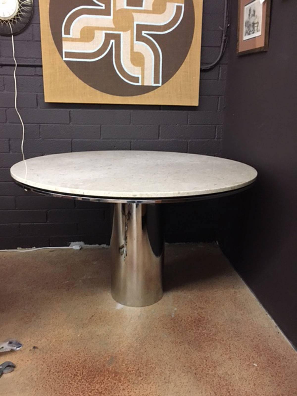Brueton Anello table in marble and chrome. Notice the separation between the marble top and the chrome directly below the marble. Neat floating aspect. The base is a seamless chromed stainless steel column that slips over a heavy steel structural