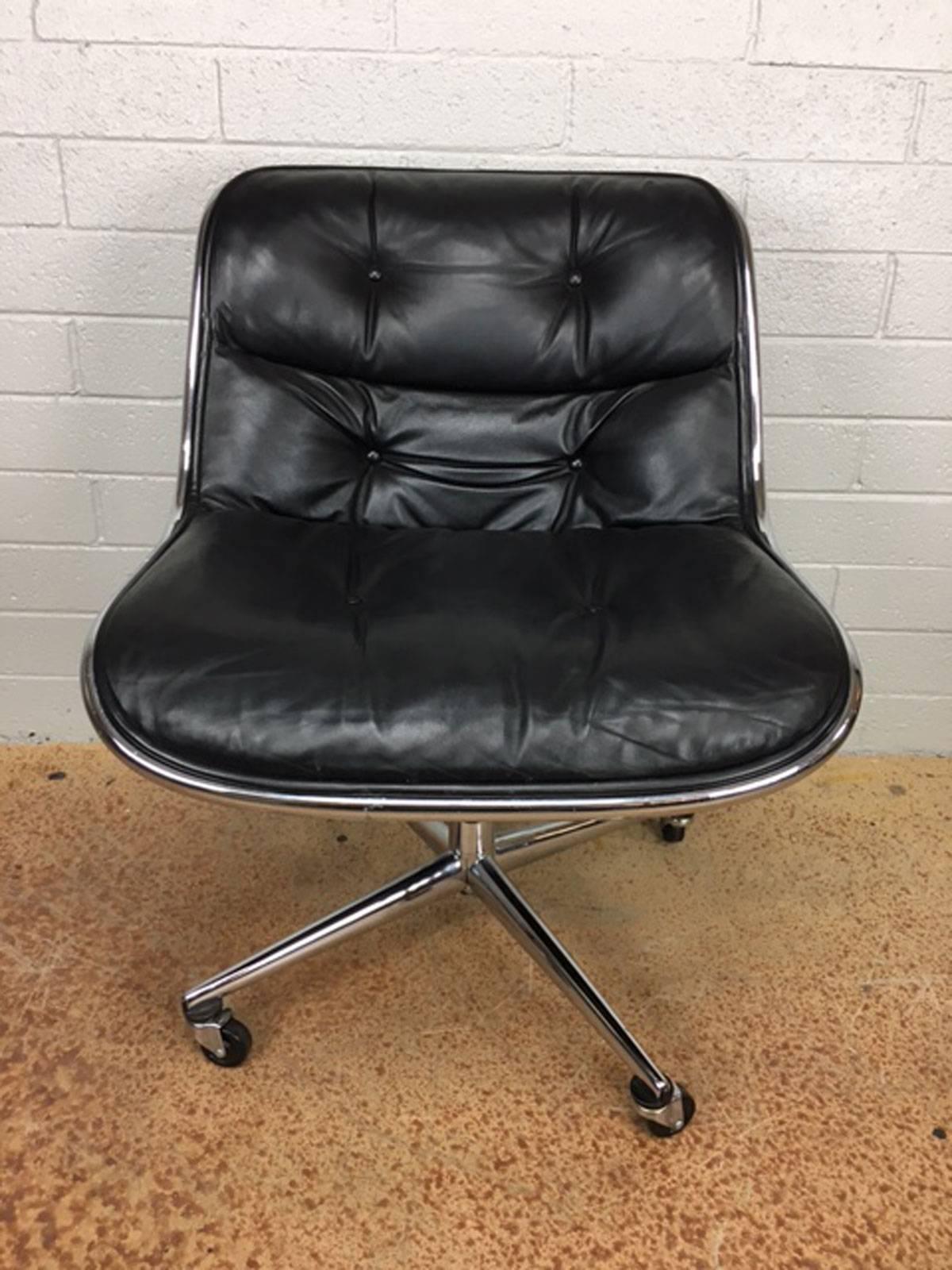 Executive side chair in black leather by Charles Pollock. Four point star base. Seat height is adjustable.