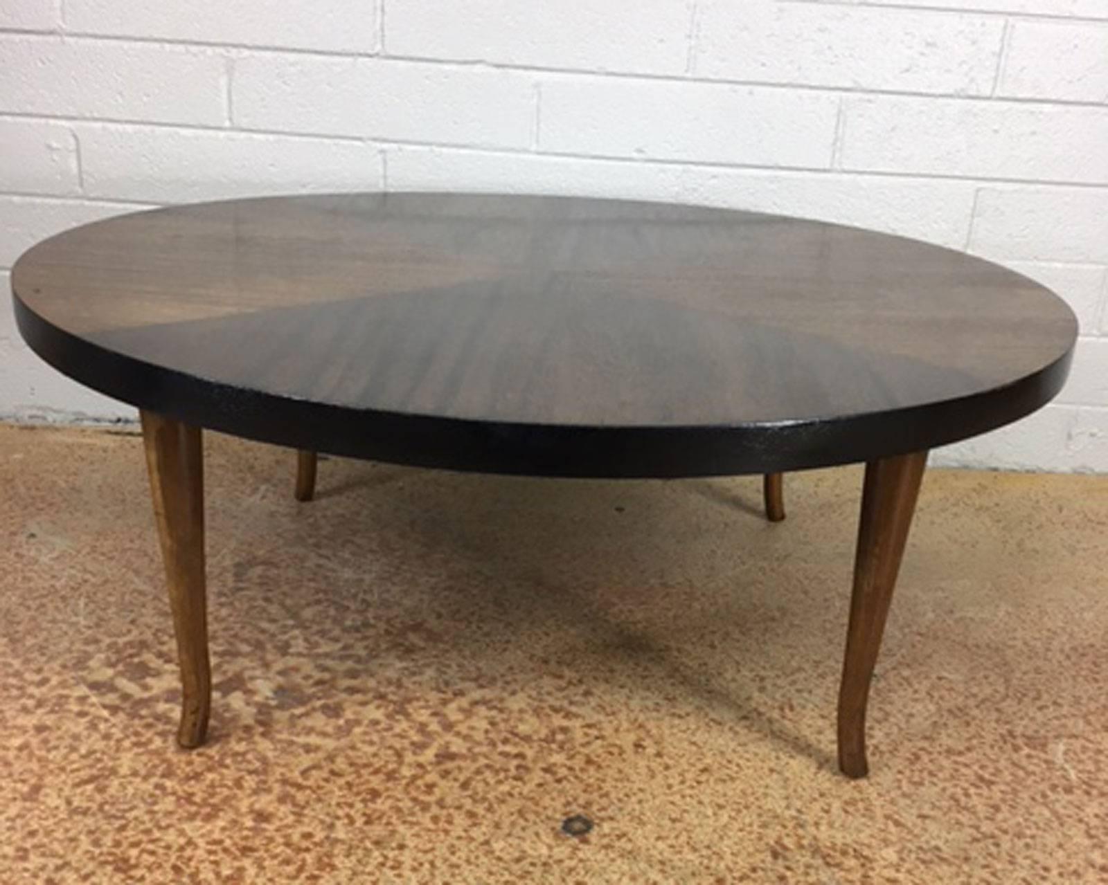 Walnut and mahogany round coffee table with a patterned inset top. Maker unknown. Refinished.
