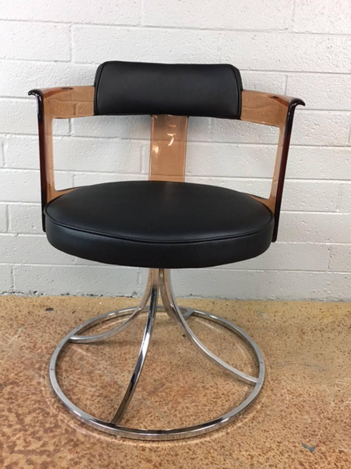 Pair of circa 1970s acrylic, leather and chrome swivel side chairs. New leather upholstery.