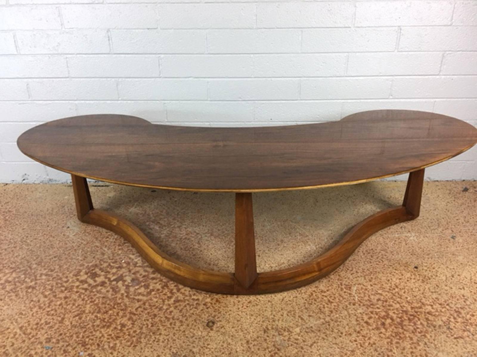 Danish Boomerang coffee table. Walnut base and teak top. Unique. Refinished and exceptional, circa 1960s.