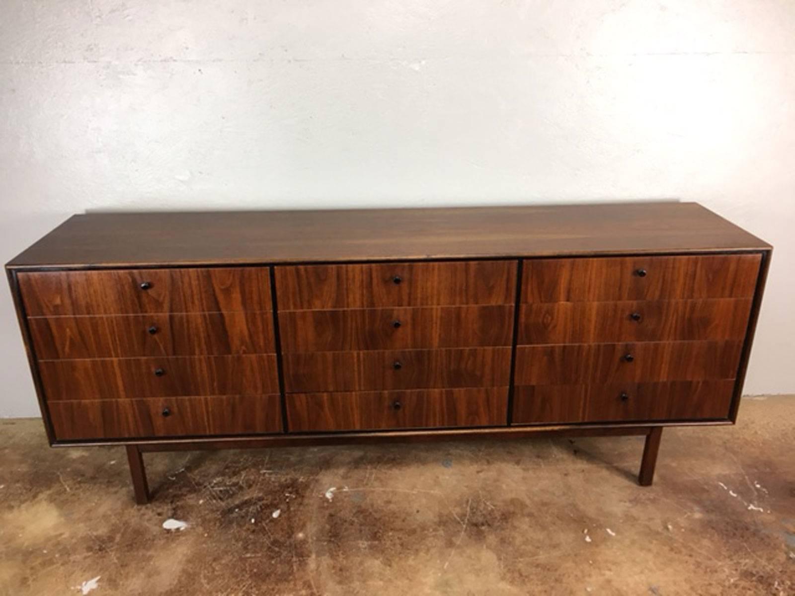 Rare 12-drawer dresser by Florence Knoll in Walnut. Original condition. Not refinished. Metal pulls. Extraordinarily nice.