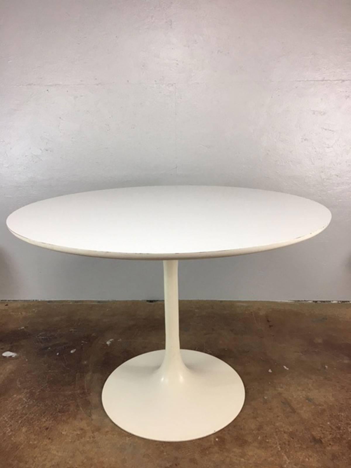 Classic tulip style dining table by Burke of Texas. Table is in very good shape overall with typical acceptable life wear for a dining table dated, circa 1970s.