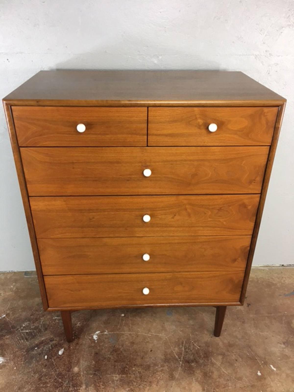 Mid-Century Modern highboy dresser designed by Kipp Stewart for Drexel furniture. This clean line highboy dresser is walnut with dovetail drawers and porcelain drawer pulls. All original. Well made and well cared for.