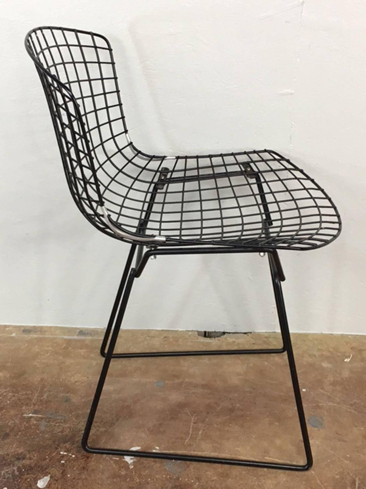 Black wire side chair by Harry Bertoia for Knoll, circa 1960s. This chair was very well maintained and remained covered in upholstery throughout its life. As such, it is in exceptional condition.