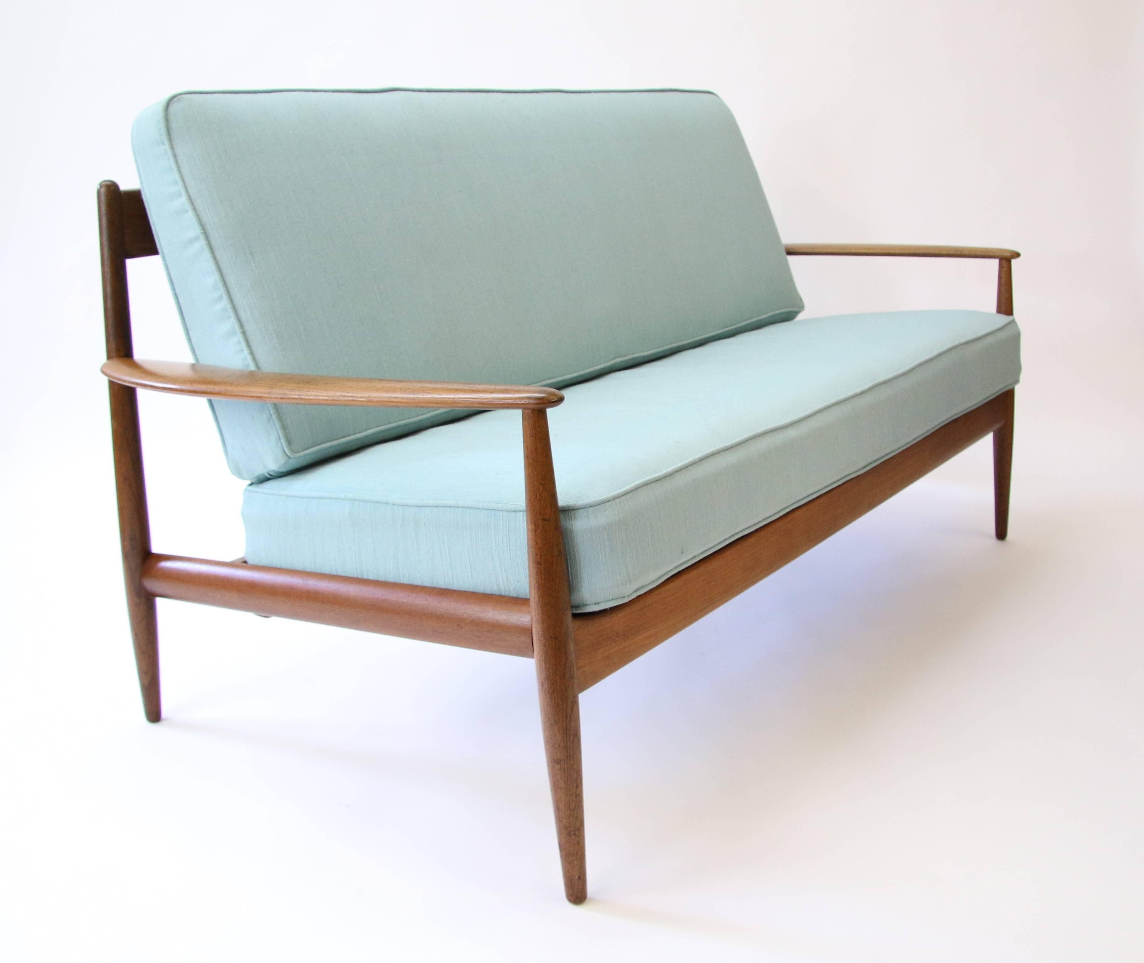 This is an early solid teak loveseat o rsette by Grete Jalk for France and Daverkosen. Excellent original condition including the original seafoam green fabric. This sofa is a one owner sofa. It has not been restored and yet shows incredibly well.