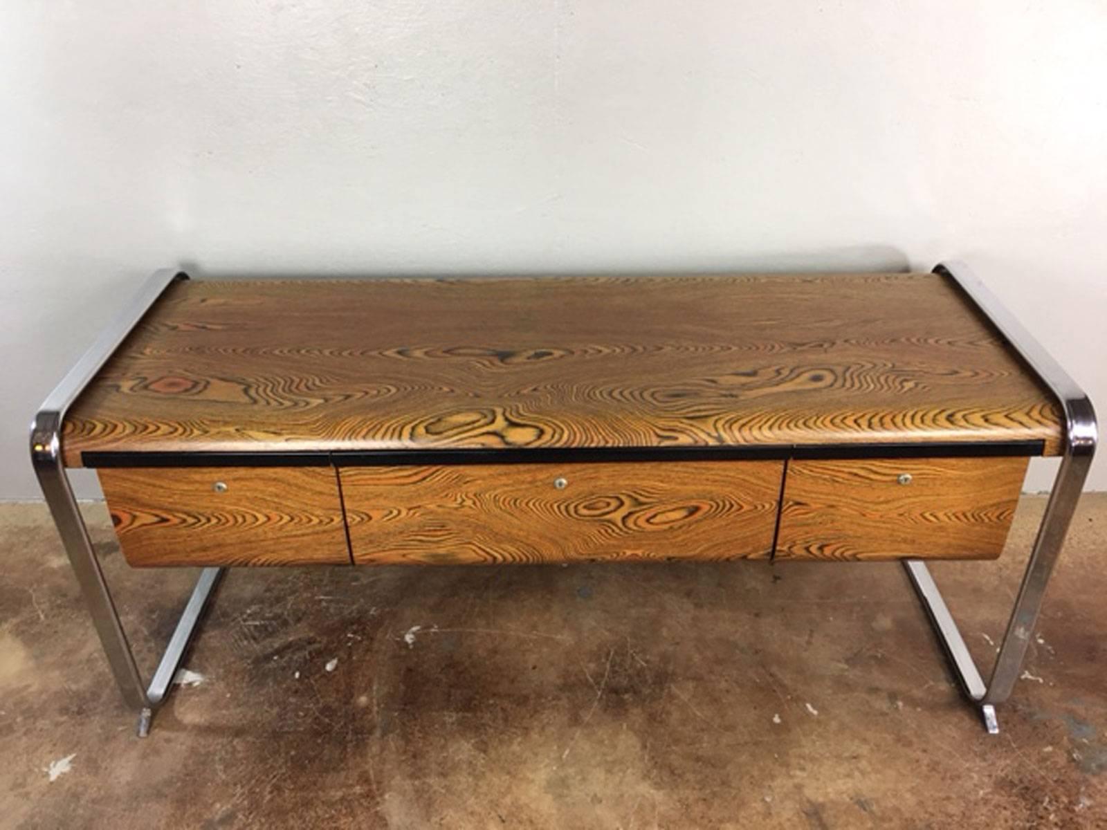 Peter Protzmann zebrawood credenza for Herman Miller with tubular chrome support wrap arounds. This credenza has three drawers with smoked acrylic sides. Great style.