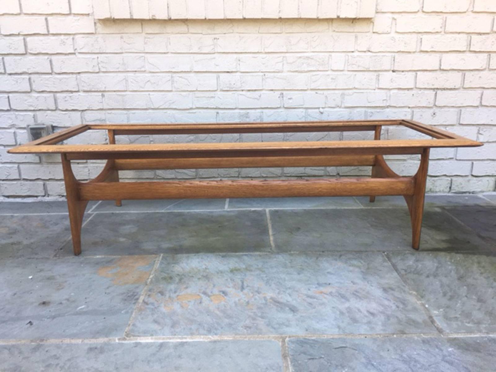 Atomic style walnut and oak coffee table by Lane. Adrian Pearsall sold his company, Craft Associates to Lane Furniture Company in 1968 and to the best of our knowledge these tables were produced in the period 1968 to the late 1970s before Lane