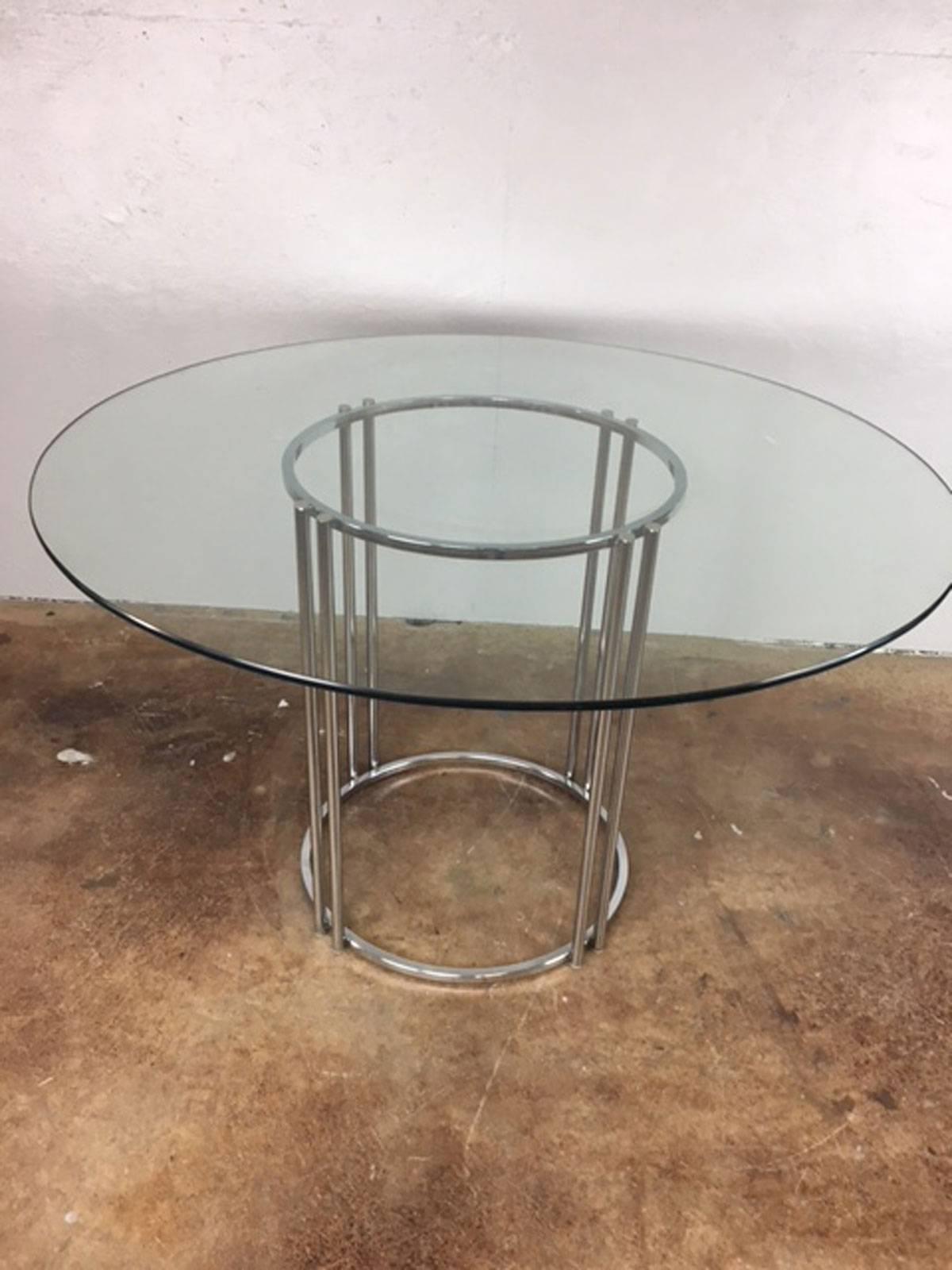 Authentic Milo Baughman chrome double tube support base dining table with glass top. Chrome and glass are in excellent condition. 48