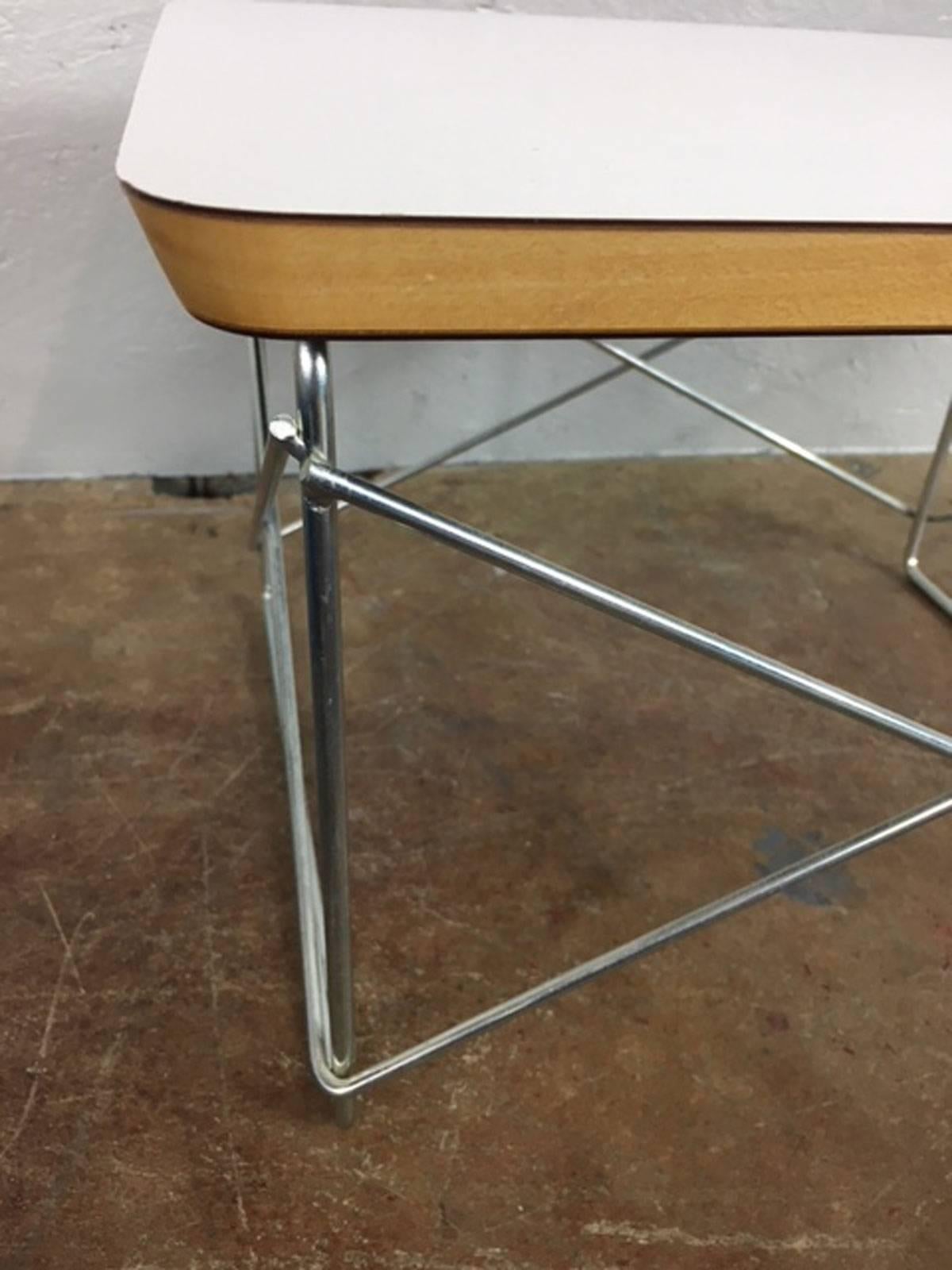 Designed by Charles and Ray Eames in the 1950s, this version of their LTR (Low Table Rod) was produced by Herman Miller in the 1970s. The base metal is zinc base. Table has a solid core and a white laminate top.