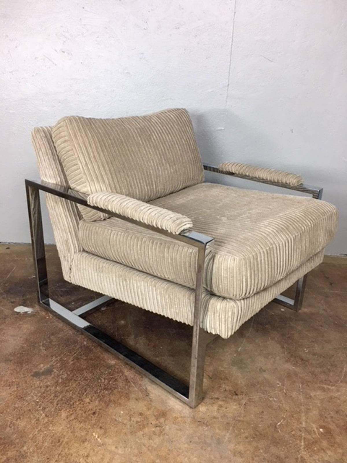 Pair of Milo Baughman chrome structured lounge chairs in a comfortable gray tone upholstery. Seat height is 19 inches.