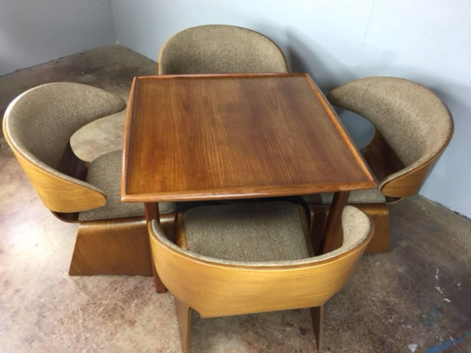 Rare set of four Hans Olsen set of four Bikini chairs and game table. Chairs were manufactured by Moreddi. Table maker is unknown but could also be Moreddi. Wood is in very good condition. Original fabric has no holes, tears, or rips, or unusual