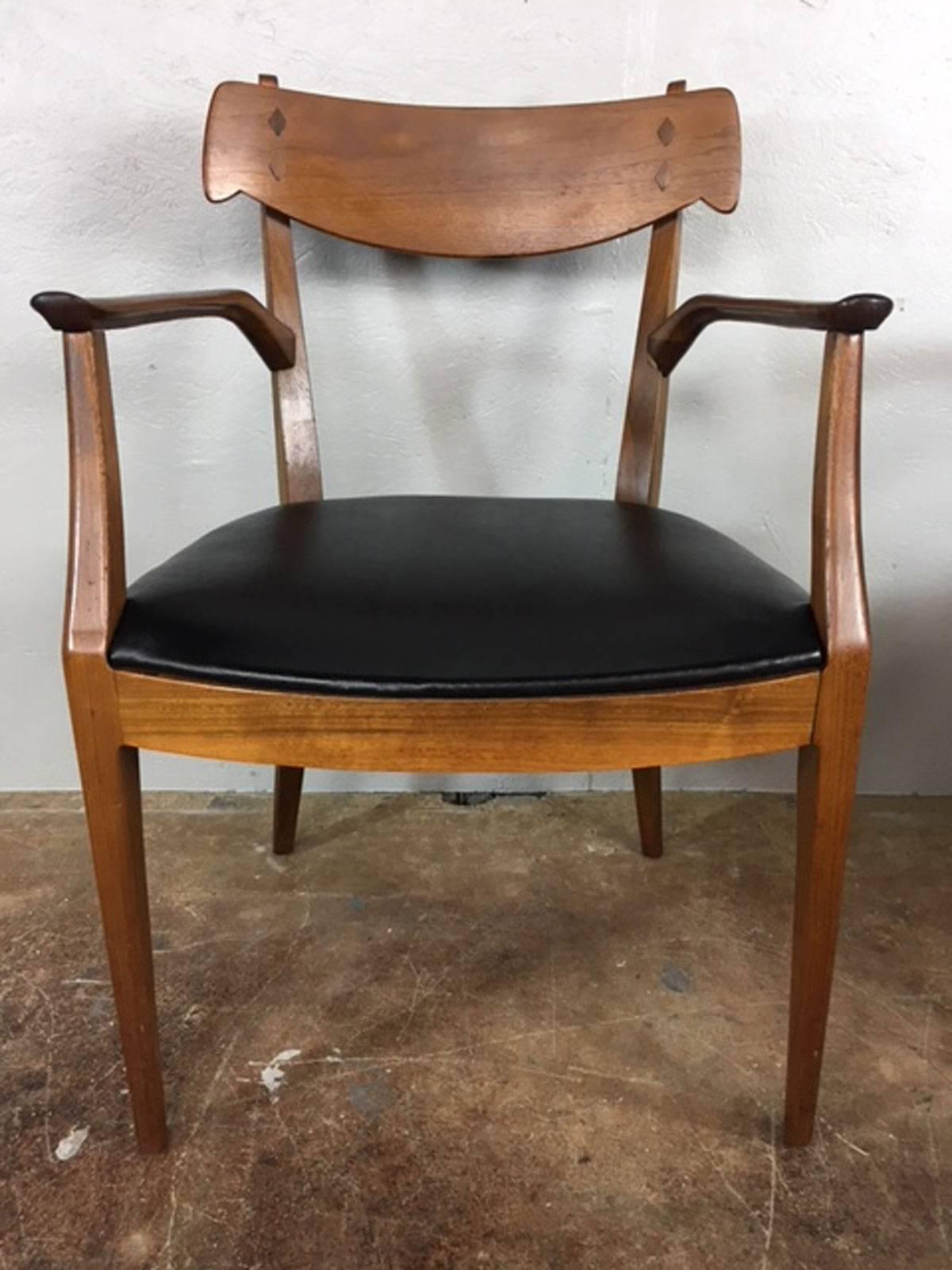 Set of four dining chairs by Kipp Stewart for Drexel in rich walnut and leather. No rips, tears, holes, or unusual wear. Original condition. 

Seat height is 17 inches.