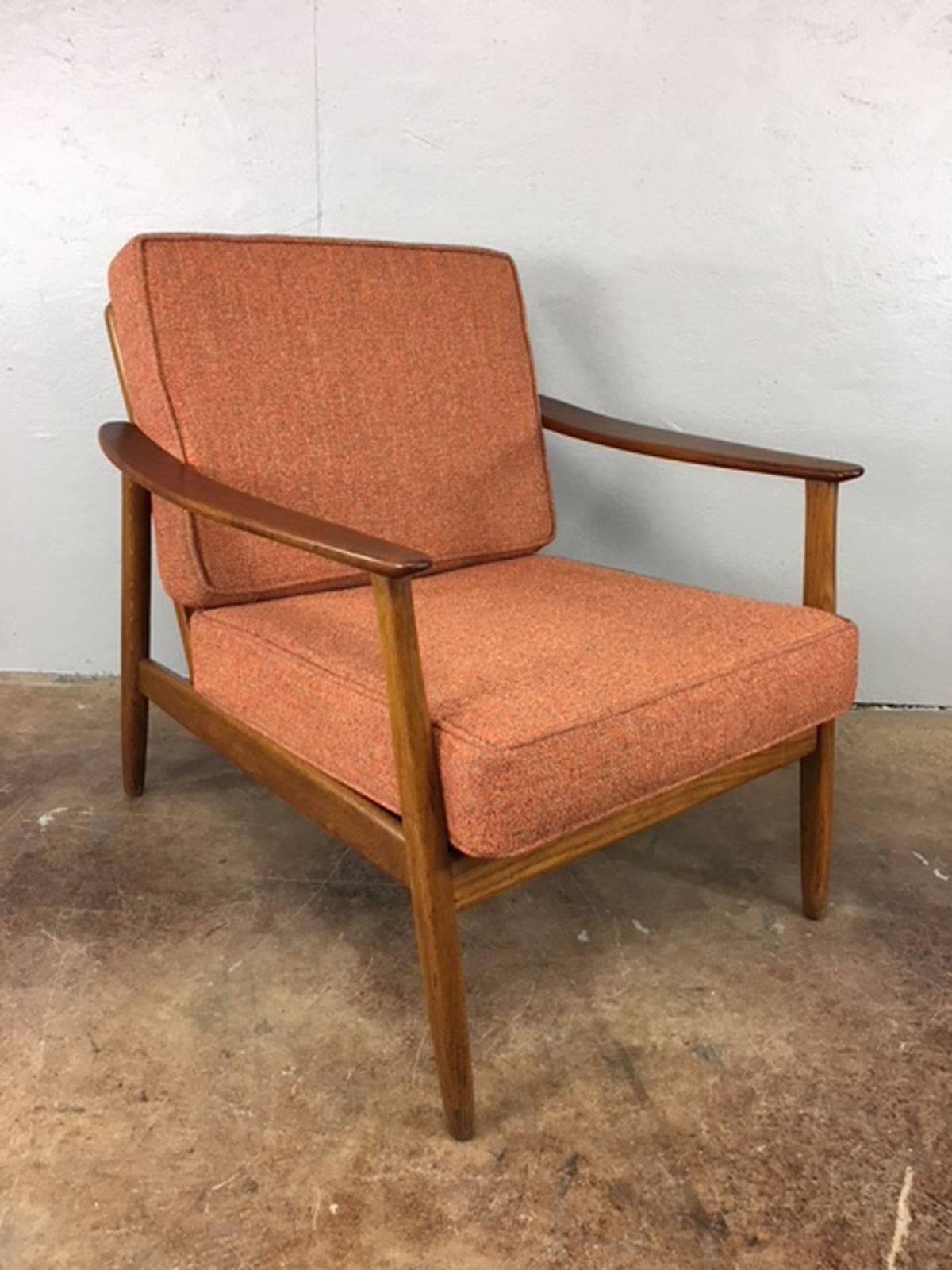 Unique cane back teak lounge chair by DUX. Attributed to Folke Ohlsson. New Upholstery. Original bottom support strapping remains in place and is functional.