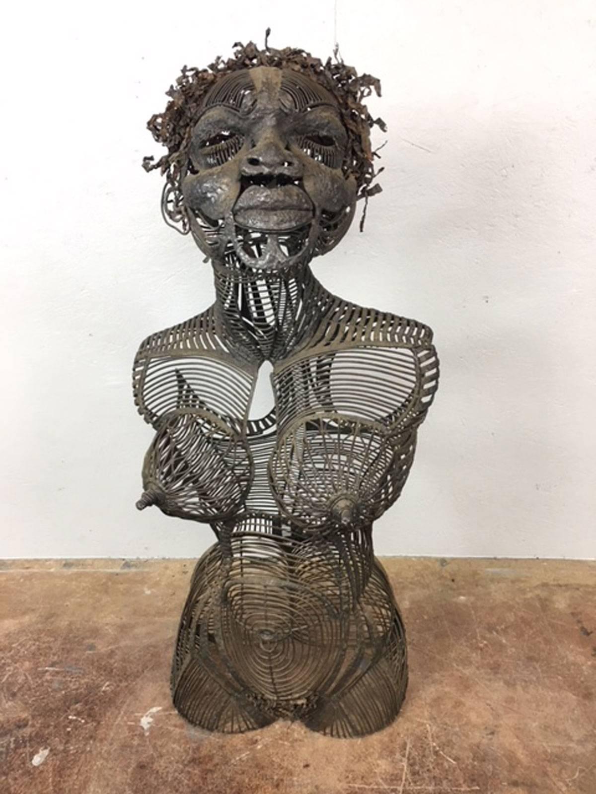 Unique metal sculpture of a woman by artist Dale Edwards titled Lucy.