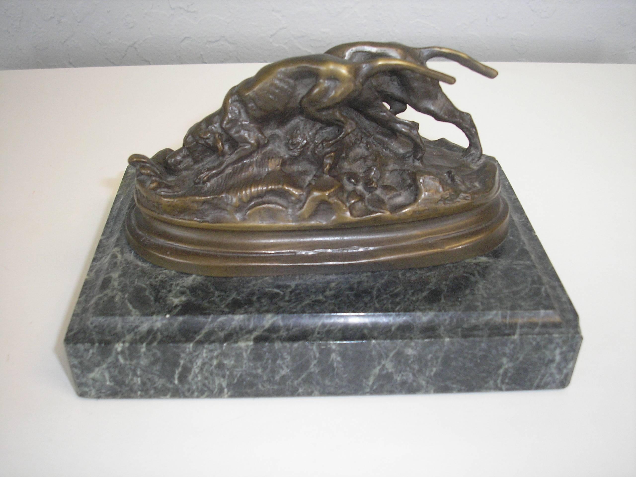 This piece is a beautiful bronze of hunting hounds by Antoine-Louis Barye, circa 1860. The base measures 7