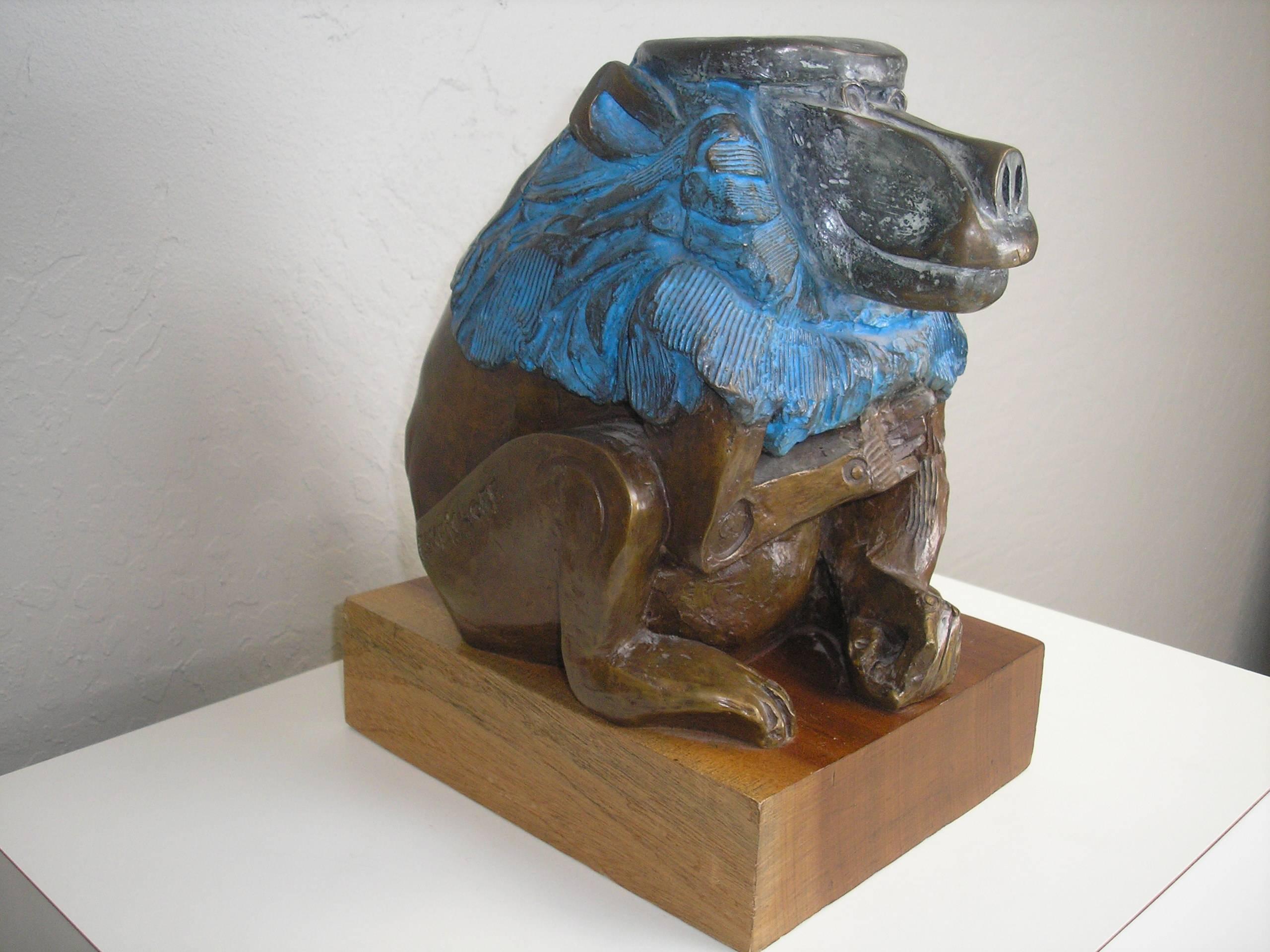 This bronze baboon was sculpted by Eleizer Weishoff, circa 1970. Numbered 16 out of 99. The back is blue tinted and a red tinted buttocks. It is mounted on a 3