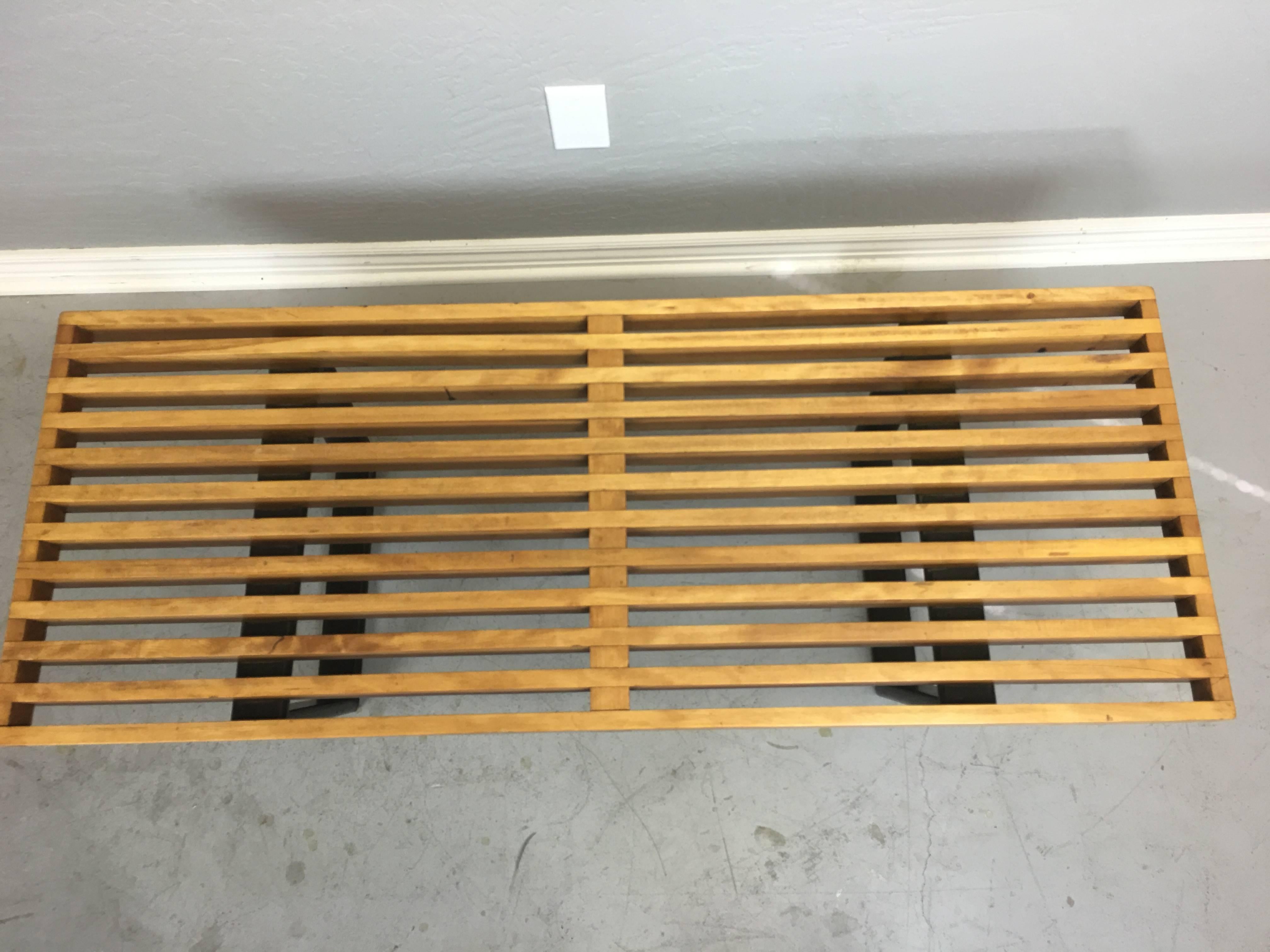 George Nelson wood slatted bench/coffee table for Herman Miller, circa 1960. No makers mark. It measures 18 3/4" wide x 48" long x 14" high. Vintage condition with nice aged patina. Has not been restored due to how attractive it is