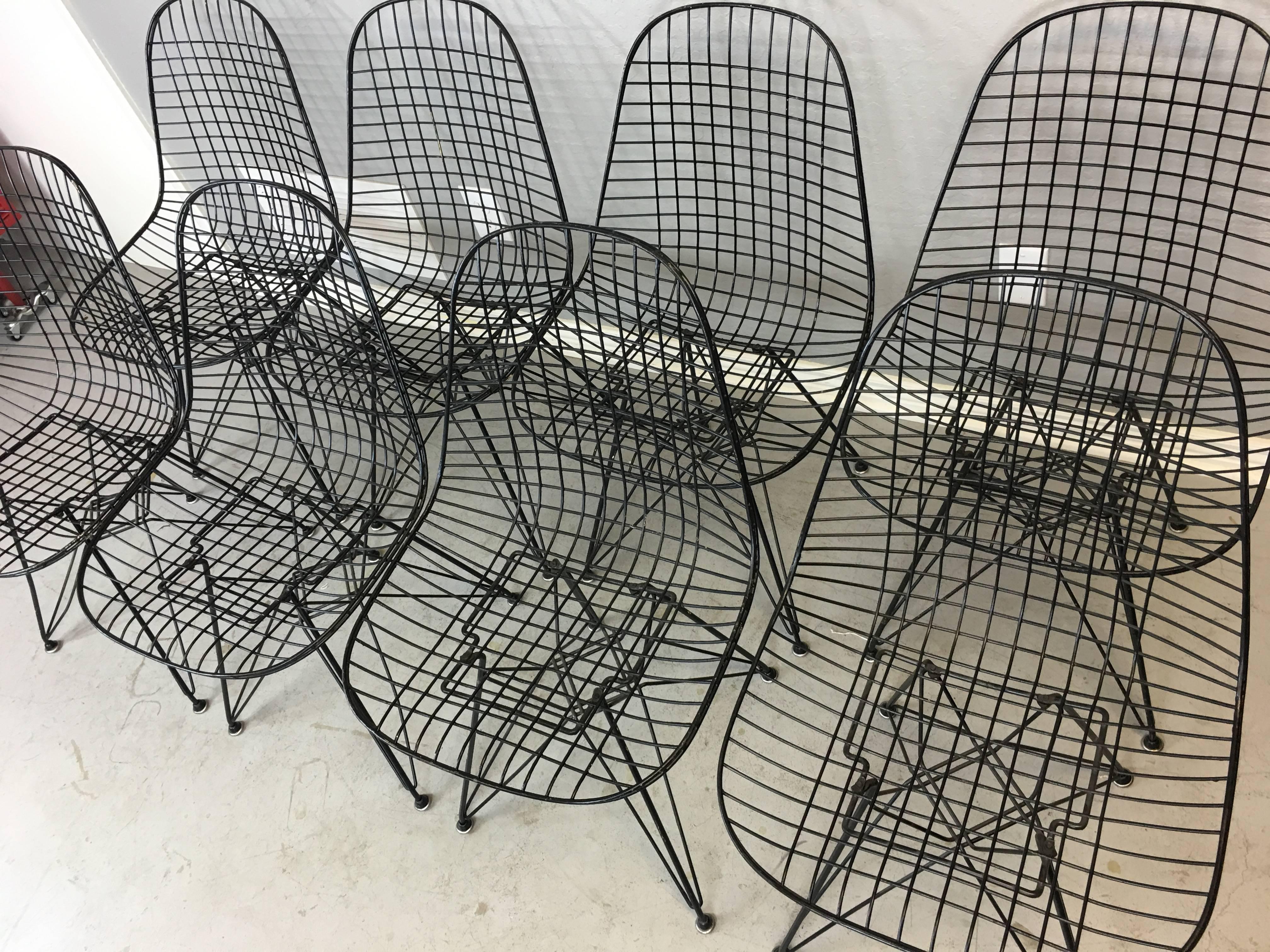 Four Charles and Ray Eames DKR.5 Eiffel base wire chairs, circa 1990. All welds are intact. Minor black paint loss. No cushions. All glides intact. May purchase these chairs in pairs. 

Price listed is per chair. 