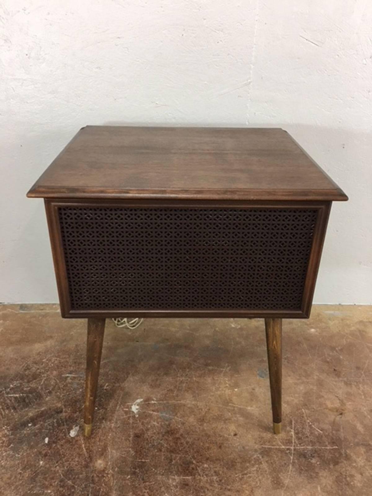 Sleek and compact RCA Victor stereo cabinet. Very good overall condition. Stereo operates properly and is in working condition. Neat little piece of history.