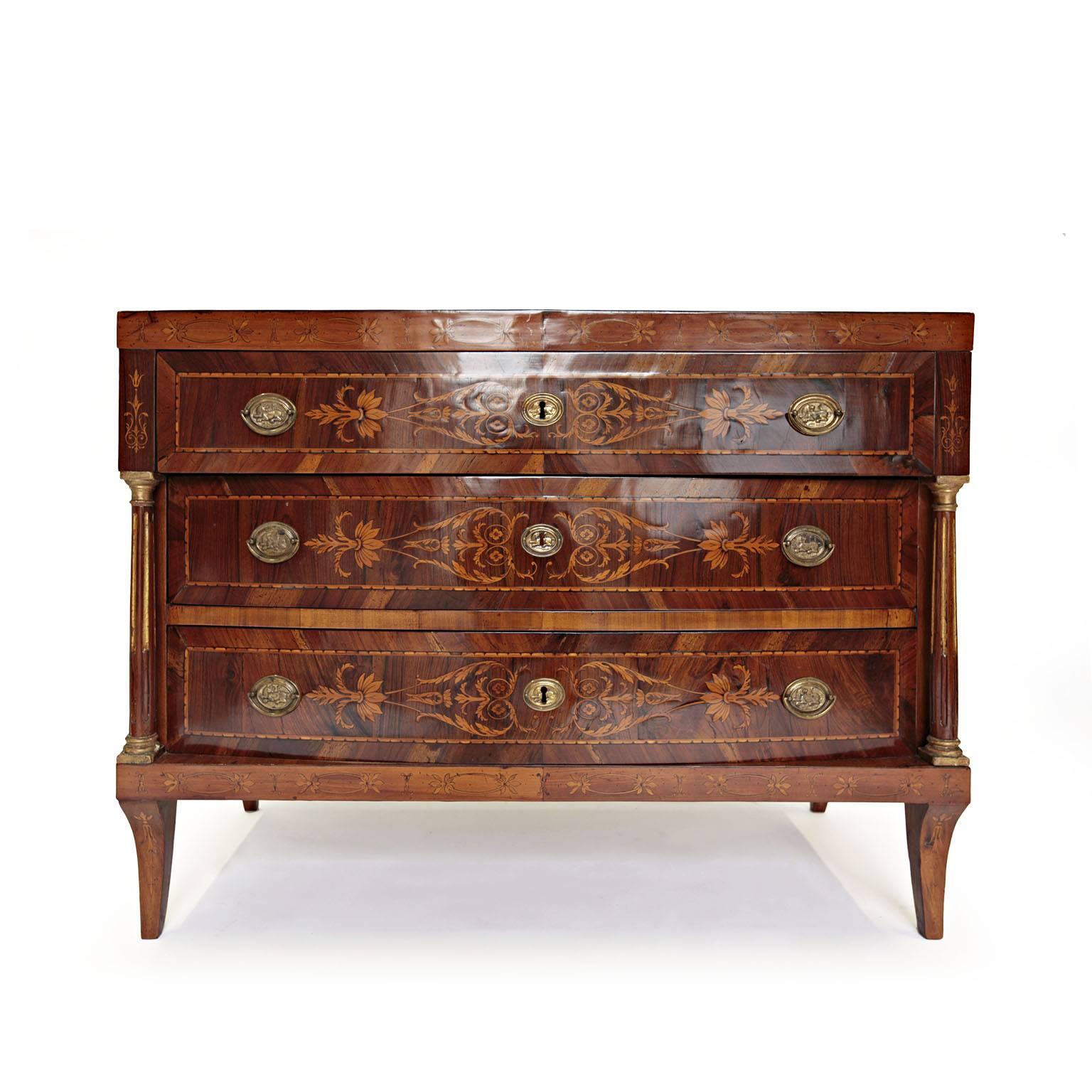 A very high quality neoclassical style, Italian, early 19th century commodes, in the manner of Maggiolini. 
Highly detailed marquetry in tulipwood, kingwood and rosewood. The commode has three drawers bronze mounted. All the three drawers have a