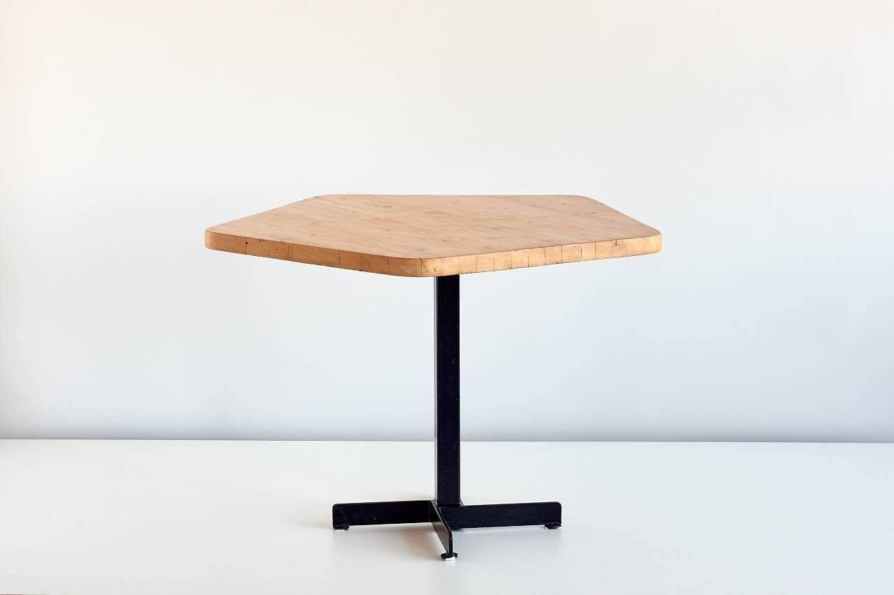 The iconic Charlotte Perriand spent 20 years working on the immensive architectural project of Les Arcs Ski Resort in Savoie, France. This dining or occasional table is one the furniture pieces she designed for this project. The combination of the