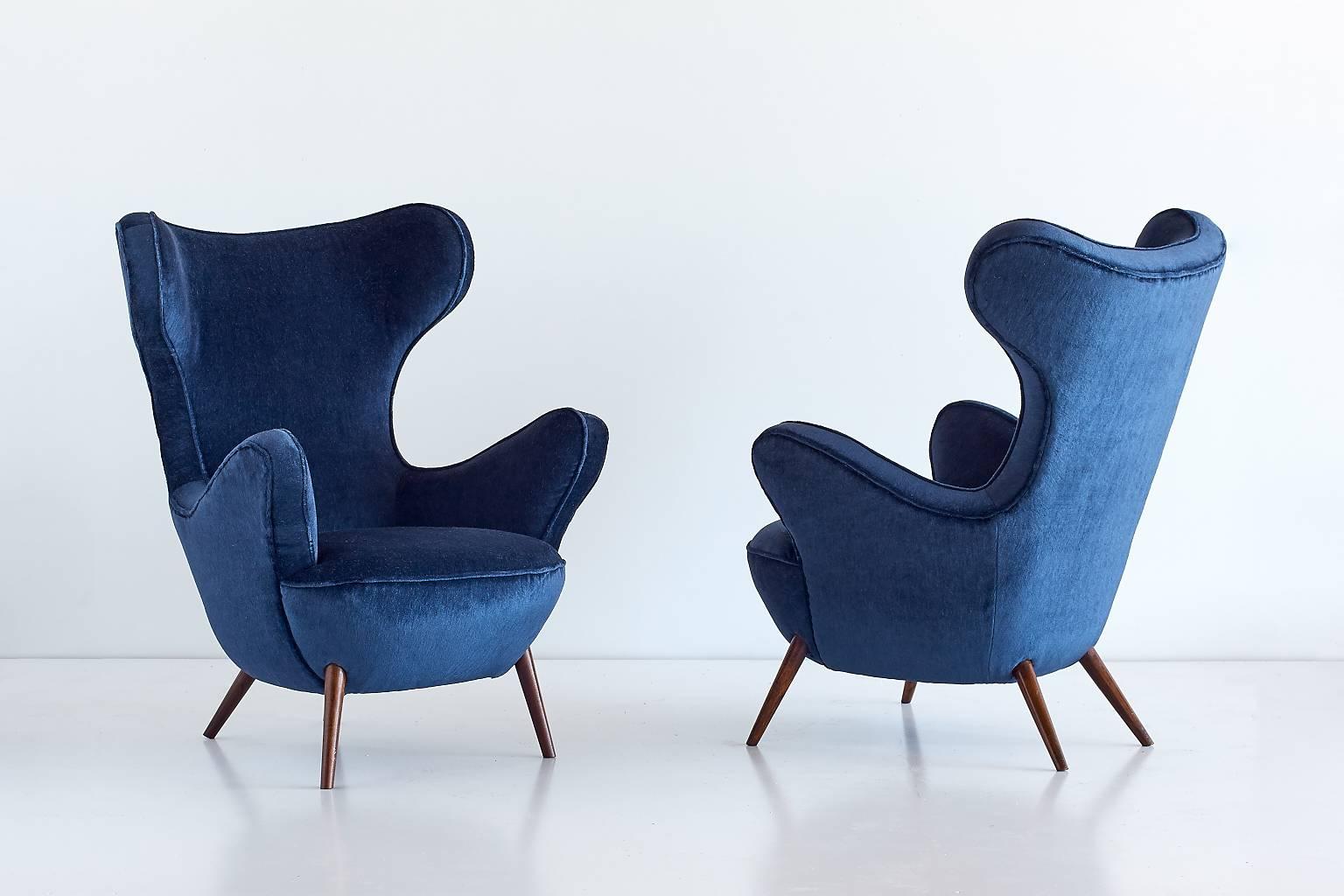 This rare pair of armchairs was designed by Paolo Malchiodi for a private residence near Florence in the late 1940s. Due to their sensual, organic curves and the strikingly positioned tapered legs the chairs evoke a sculptural and modern feel.
