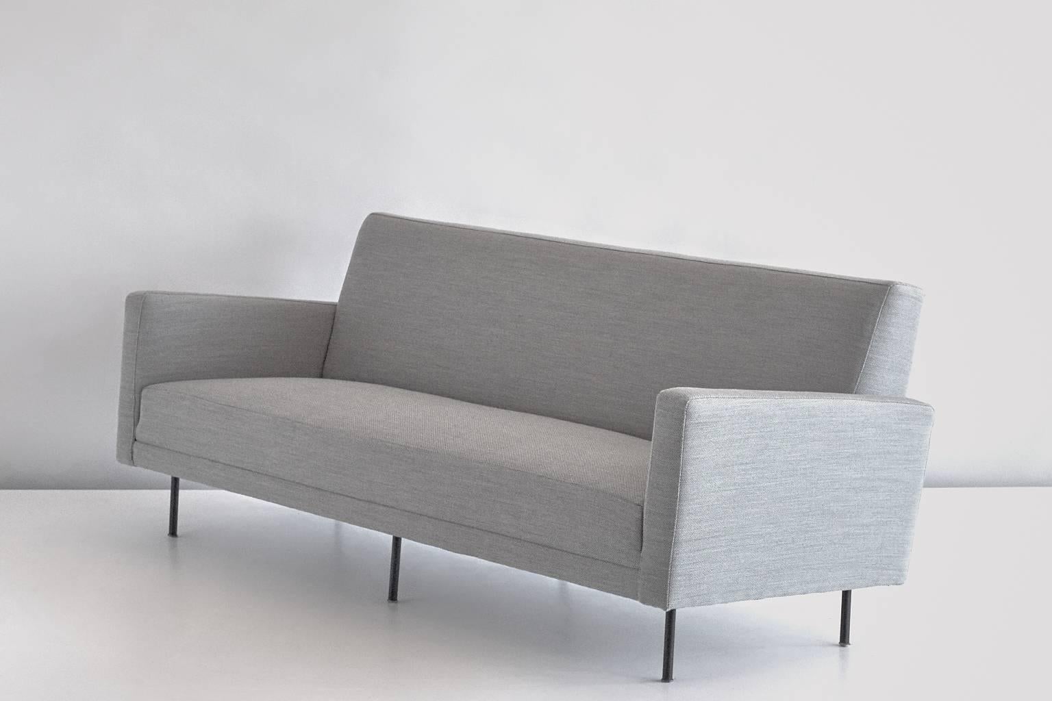 A rare three-seat sofa designed by Florence Knoll for Knoll International and produced by De Coene in the late 1950s. The sofa has been fully reconditioned and reupholstered in a grey Kvadrat Steelcut Trio fabric.

From 1954 onwards, the renowned