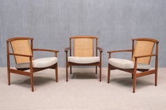 Three Folke Ohlsson 'Dallas' Armchairs in Teak and Cane, DUX, Sweden, 1960s