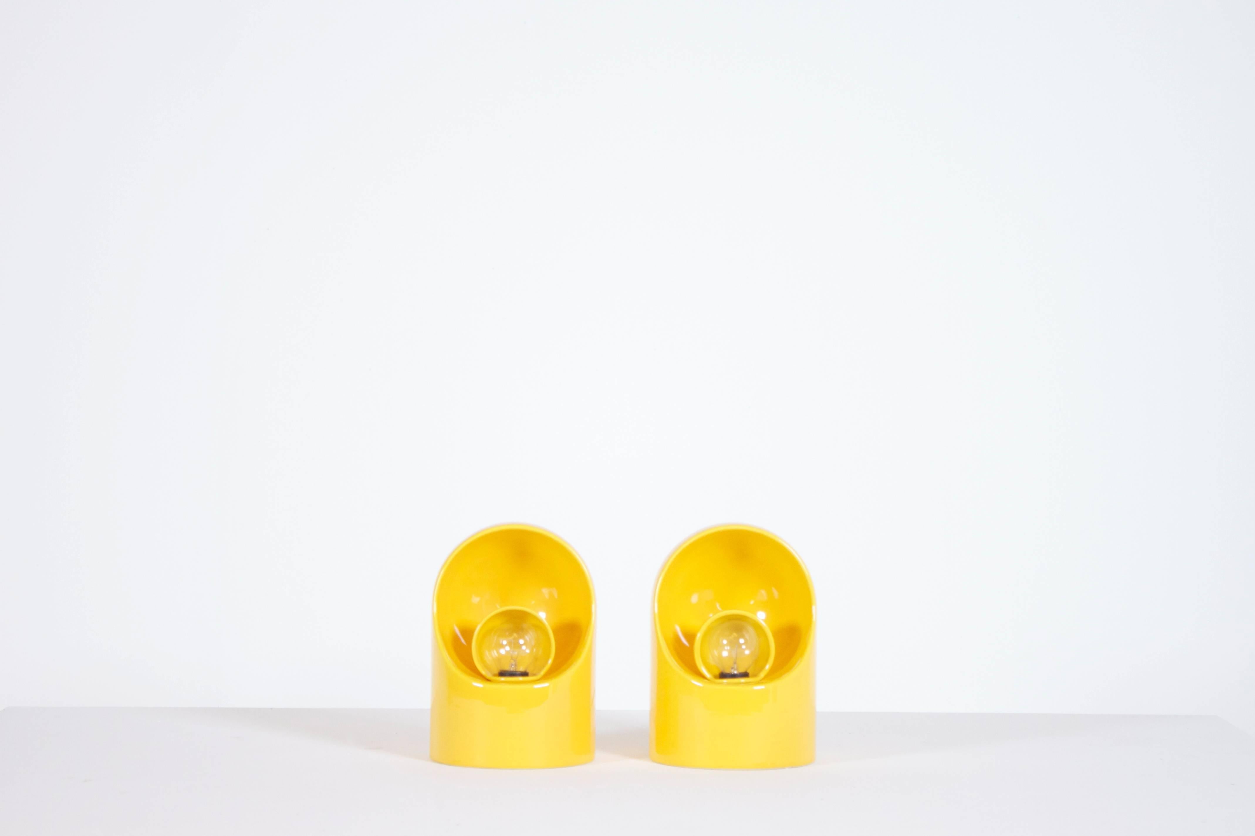 Set of ceramic table lamps by Marcello Cuneo in a beautiful yellow color.

Revolving ceramic shade.

Marked on the bottom.

These lamps are in great condition.

If you have any questions, please feel free to contact us.