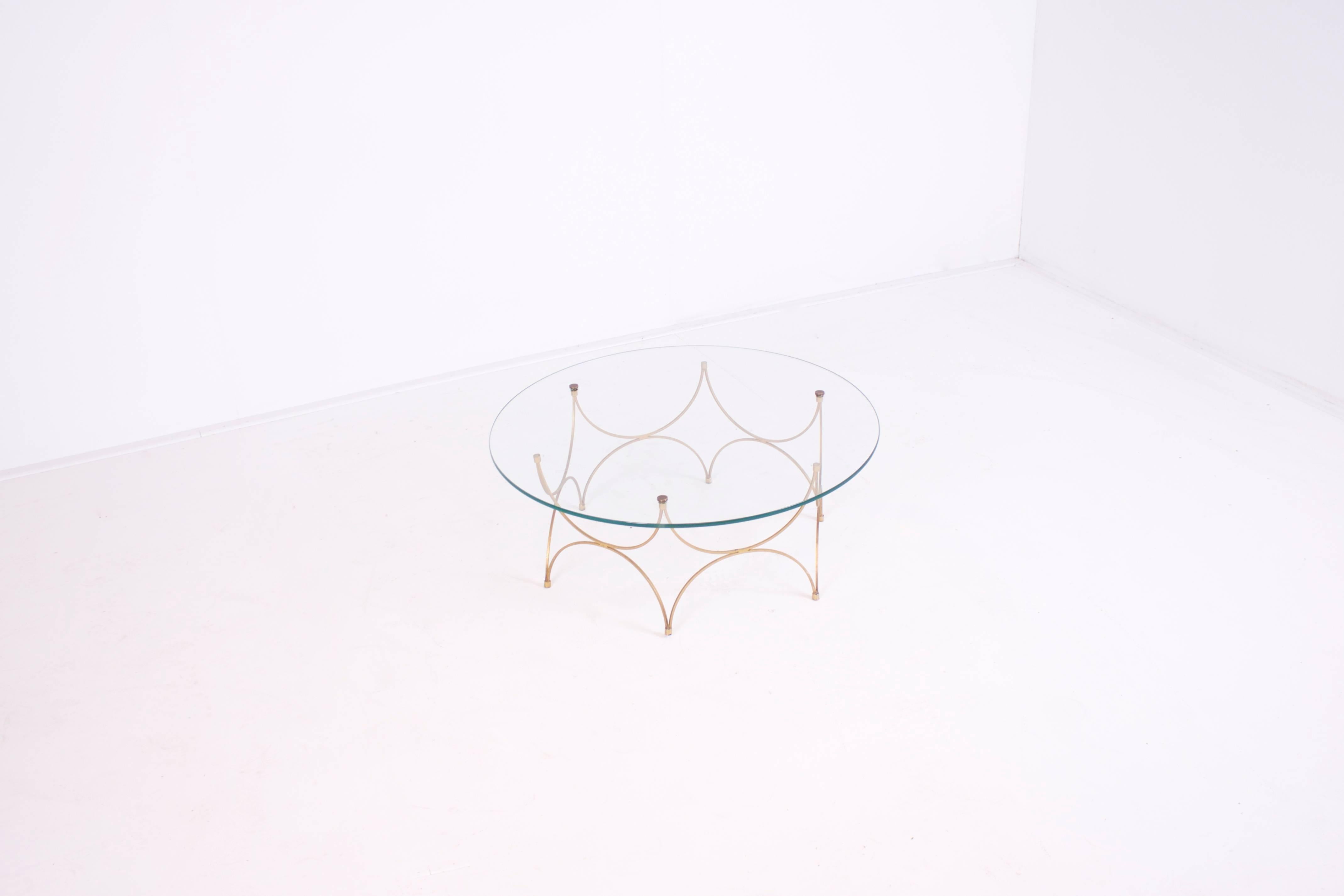 Beautiful small French coffee table in very good condition.

Base in gold.

The glass top is held in to place by brass screws. 

From now on all large and fragile overseas transports from Cadmium will be handled by the Tramo Group.

Tramo is the