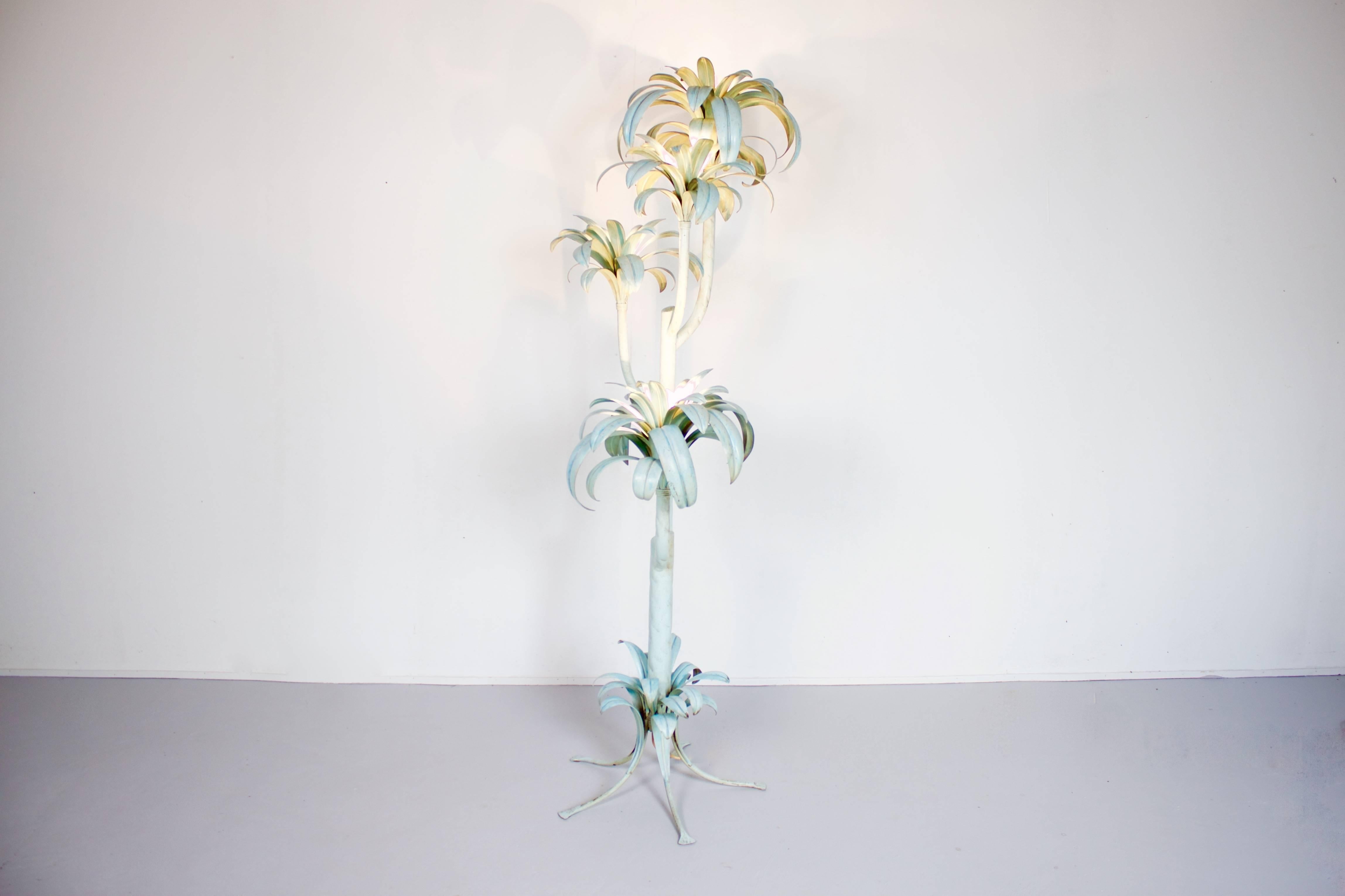 Impressive 1970s, Hollywood Regency palm tree floor lamp. 

All metal, lacquered in a light blue color. 

Four sockets between the palm leaves.

From now on all large and fragile overseas transports from Cadmium will be handled by the Tramo