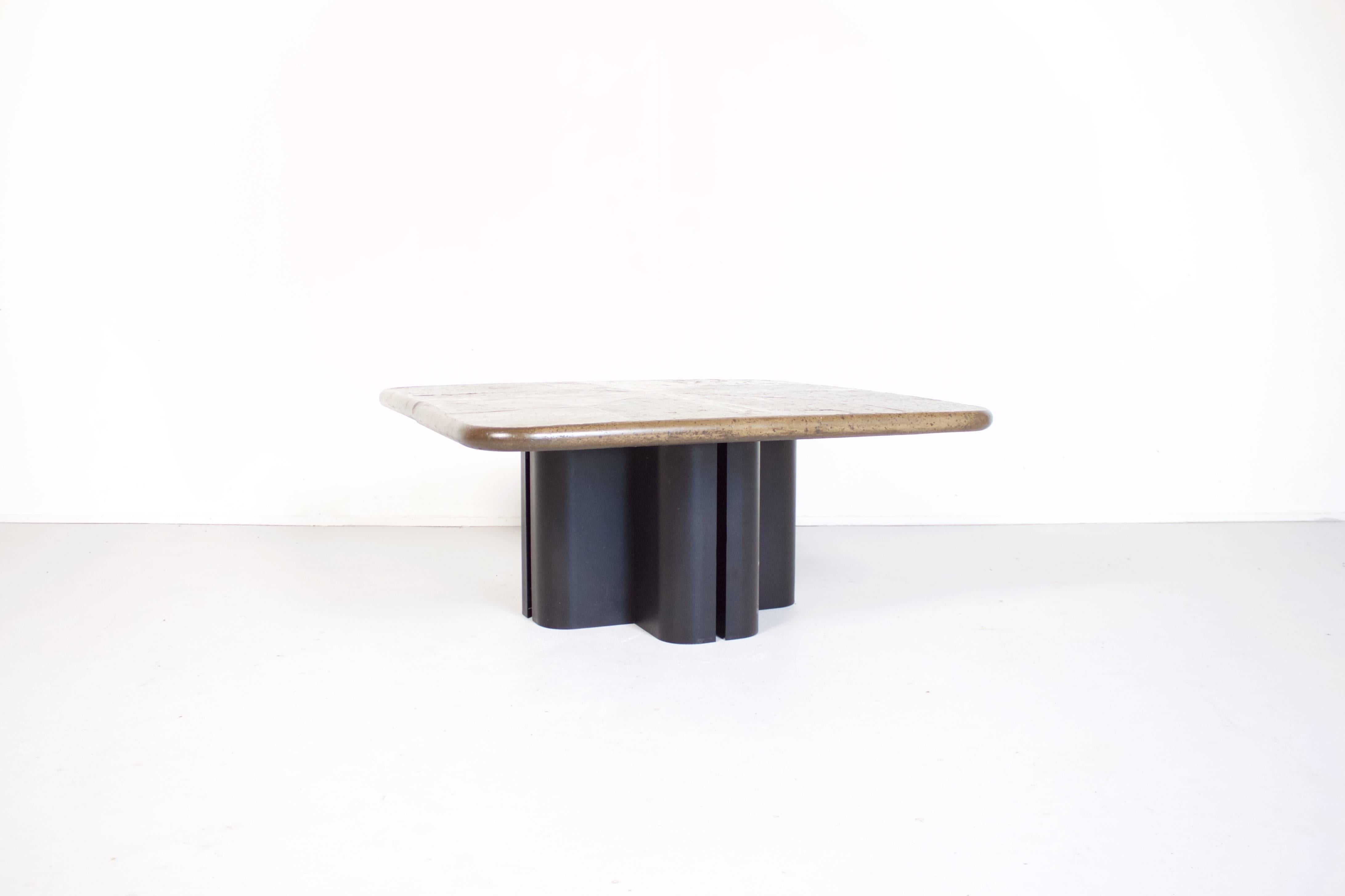 Unique Brutalist coffee table in the style of the Dutch sculpture M. Kingma. 

The tabletop is a mosaic of slate panels and brass details. 

The table is signed by the artist on a brass insert on the tabletop. 

Shaped base in black steel. 

This