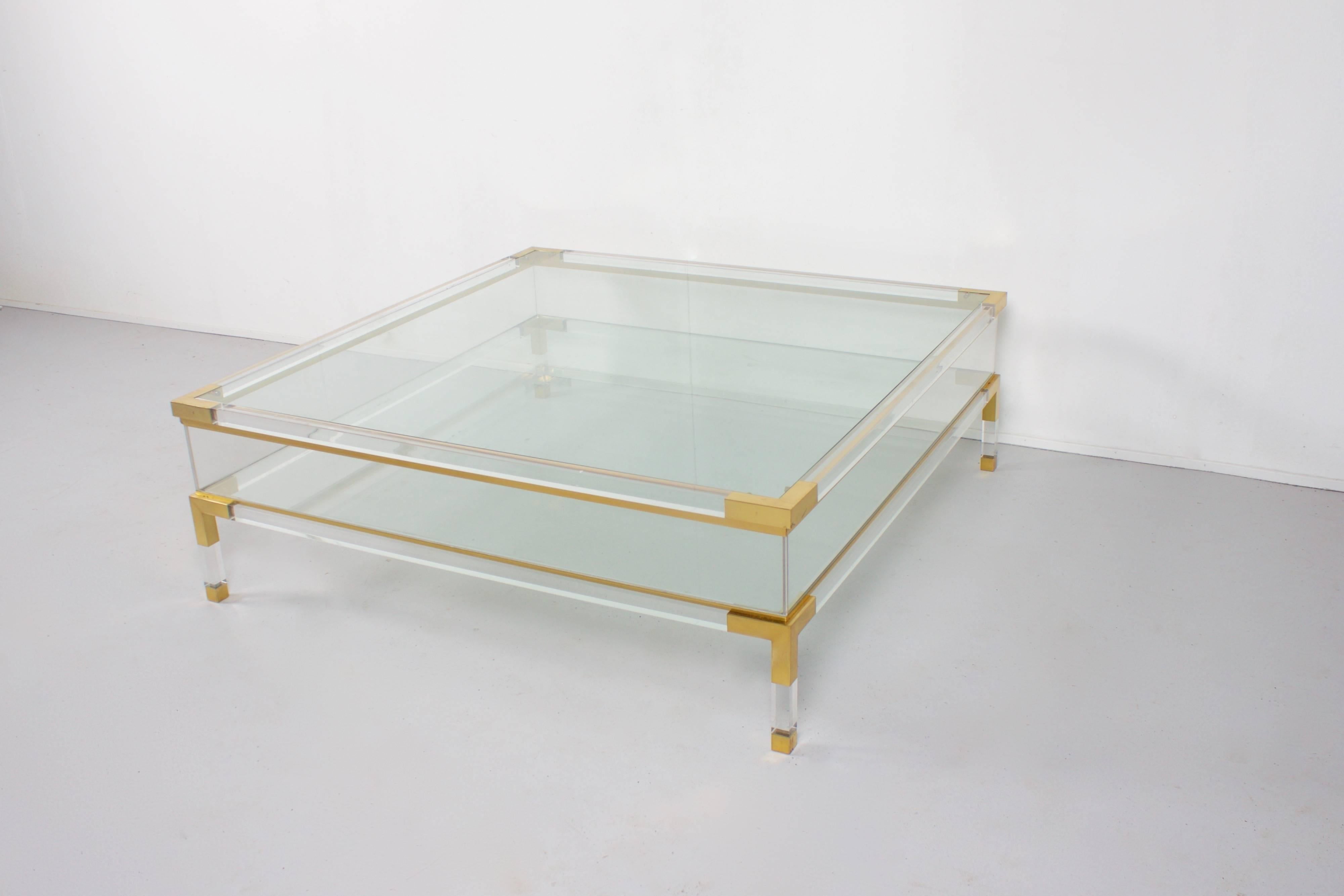 Beautiful 1970s coffee table by Maison Jansen. 

Lucite with brass details and glass tops. 

The top can slide open to reveal the inside compartment.

If you have any questions, please feel free to contact us. 

Hollywood Regency, Willy