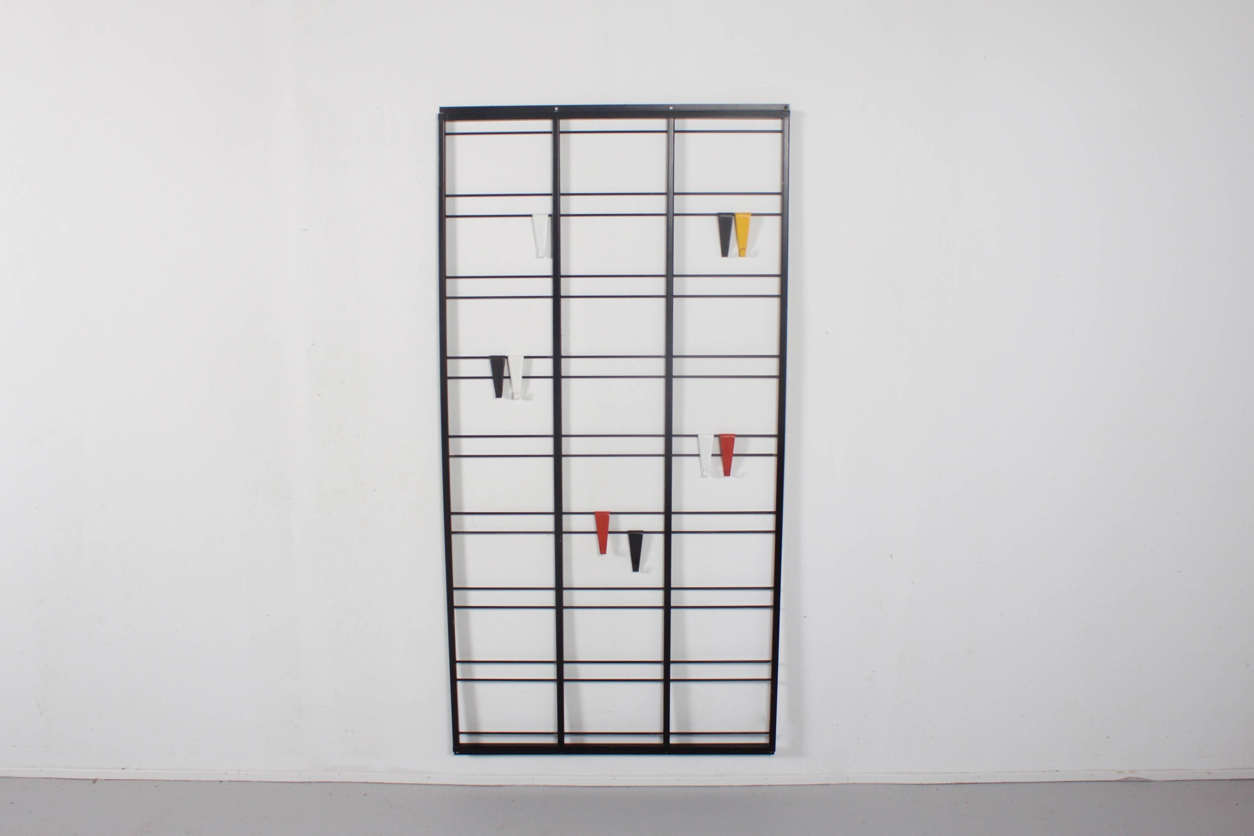 Original Dutch 'Note Ladder' coat rack by Pilastro.

This wall-mounted rack has metal frame with nine colorful adjustable metal hooks.

Designed by Tjerk Reijenga in the 1950s, Tjerk Reijenga was appointed as chief designer for the entire Pilastro