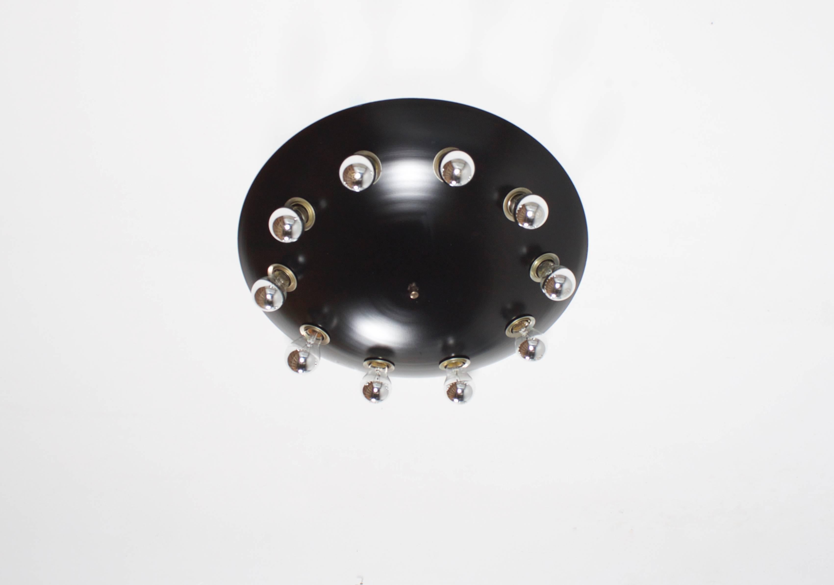 Italian flush mount in very good condition,

1960s.

Aluminium half globe lacquered black.

Ten light fixtures, rewired for US use.

In the style of: Sarfatti, Stilnovo, Arteluce, Sciolari.

 