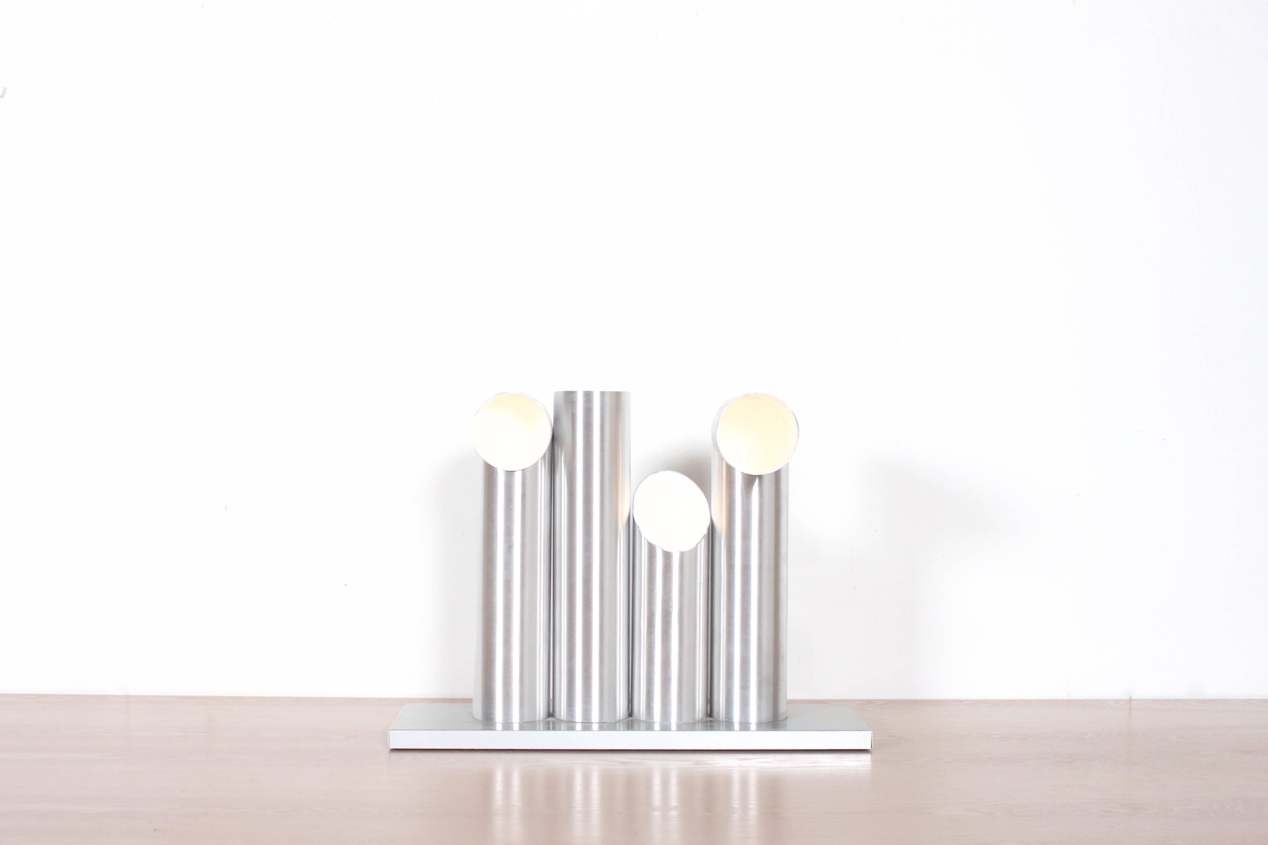 Very rare RAAK ‘Light Sculpture’ table floor lamp in very good condition.

The lamp consists of four anodized aluminum tubes, they all have a different shape and can be exchanged among each other in endless combinations.

The lamp holds one bulb per