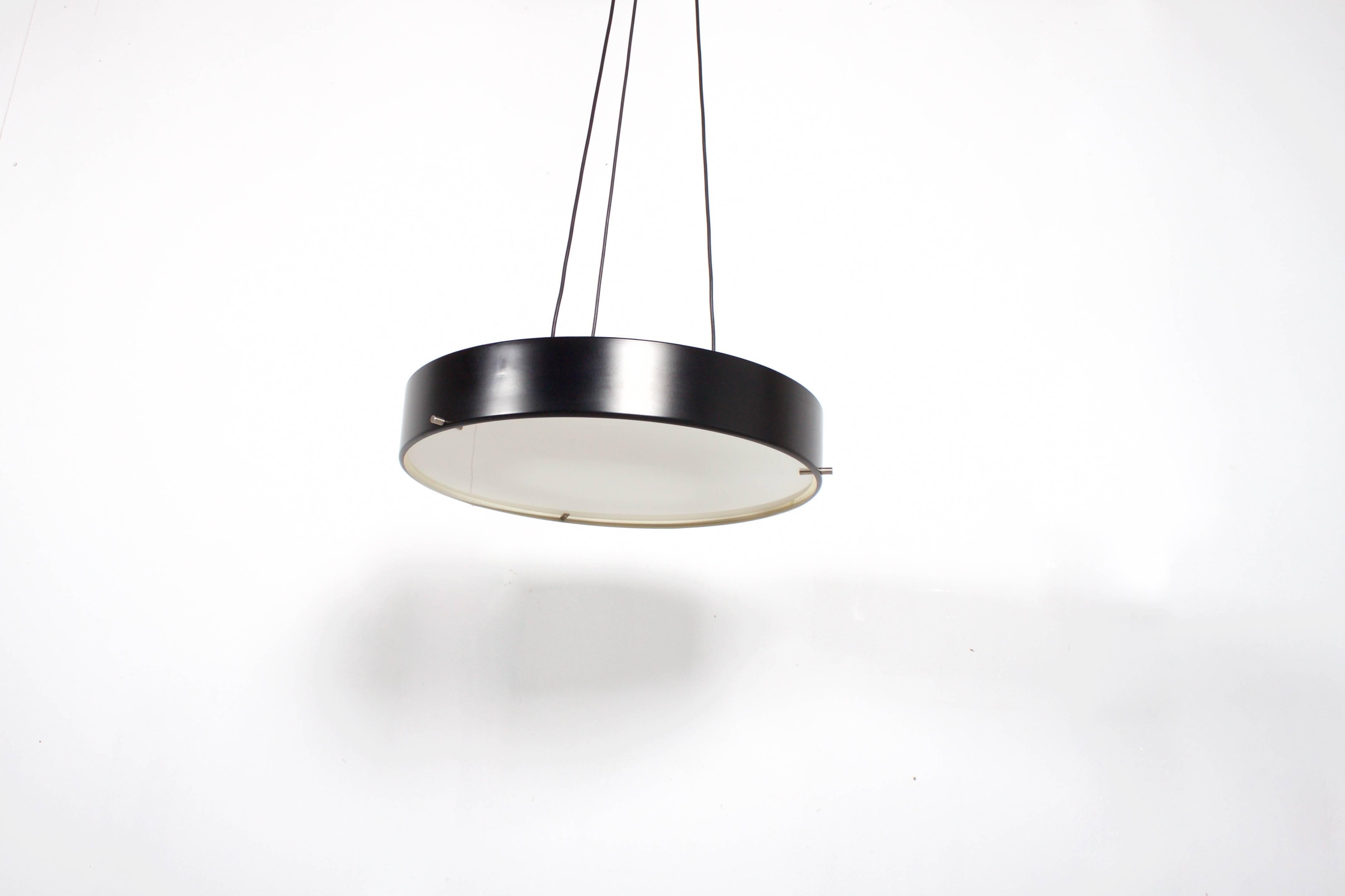Rare Stilnovo Gatta 1090 Pendant in very good original condition.

Design: Bruno Gatta

Marked: Stilnovo 

Black lacquered aluminum shade which holds a large opaline diffuser by three nickel pens.

The lamp hangs on three electrical wires which are