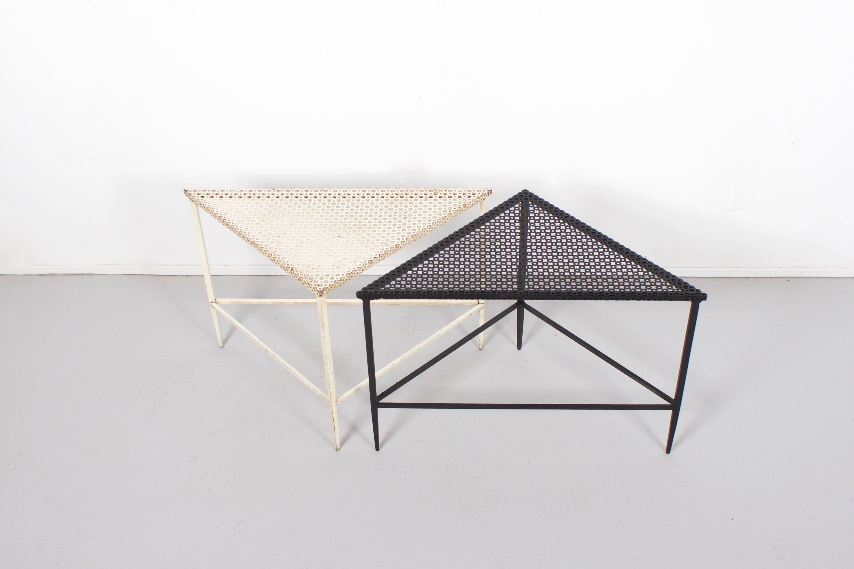 Beautiful pair of Mathieu Matégot tables in good condition.

Manufactured by Artimeta in the 1950s

Perforated metal top and frame lacquered in black and white. 

Because of the triangular shape of the tables they can be combined in many